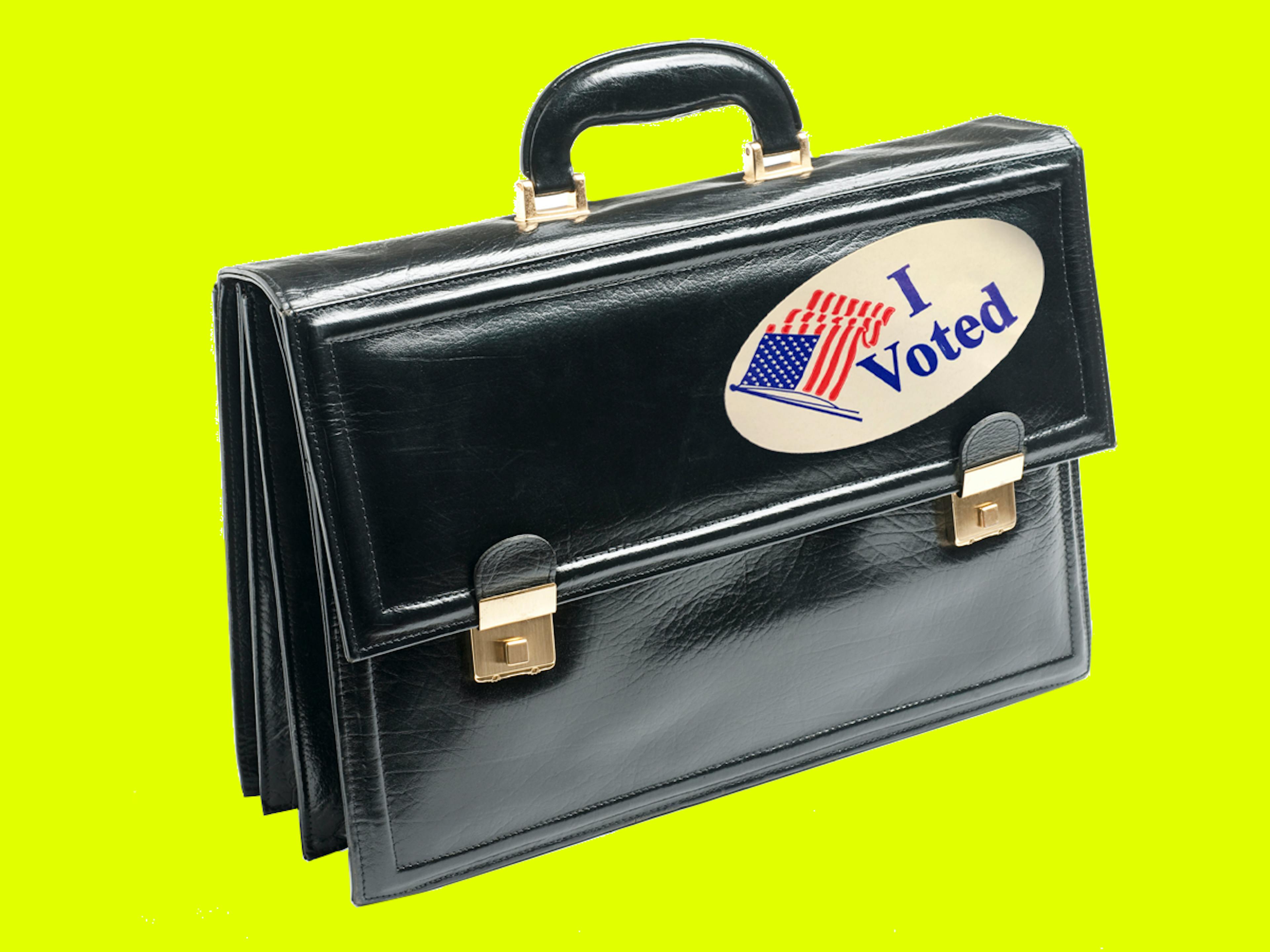 A briefcase with an "I voted" sticker on it
