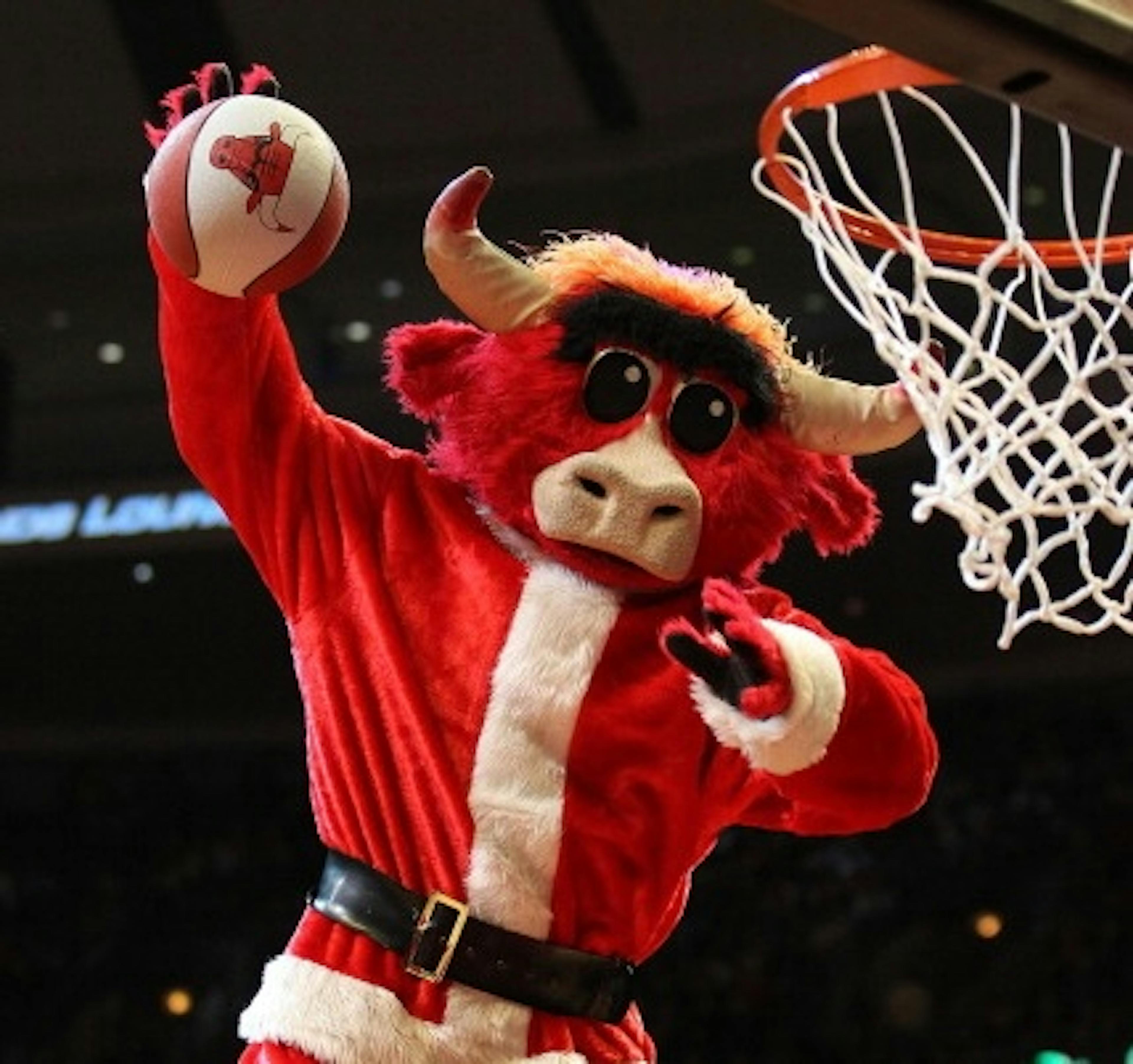 CHICAGO, IL - DECEMBER 21: Chicago Bulls mascot "Benny" dunks a ball dressed as Santa Claus during a break in a game between the Bulls and the Philadelphia 76ers at the United Center on December 21, 2010 in Chicago, Illinois
