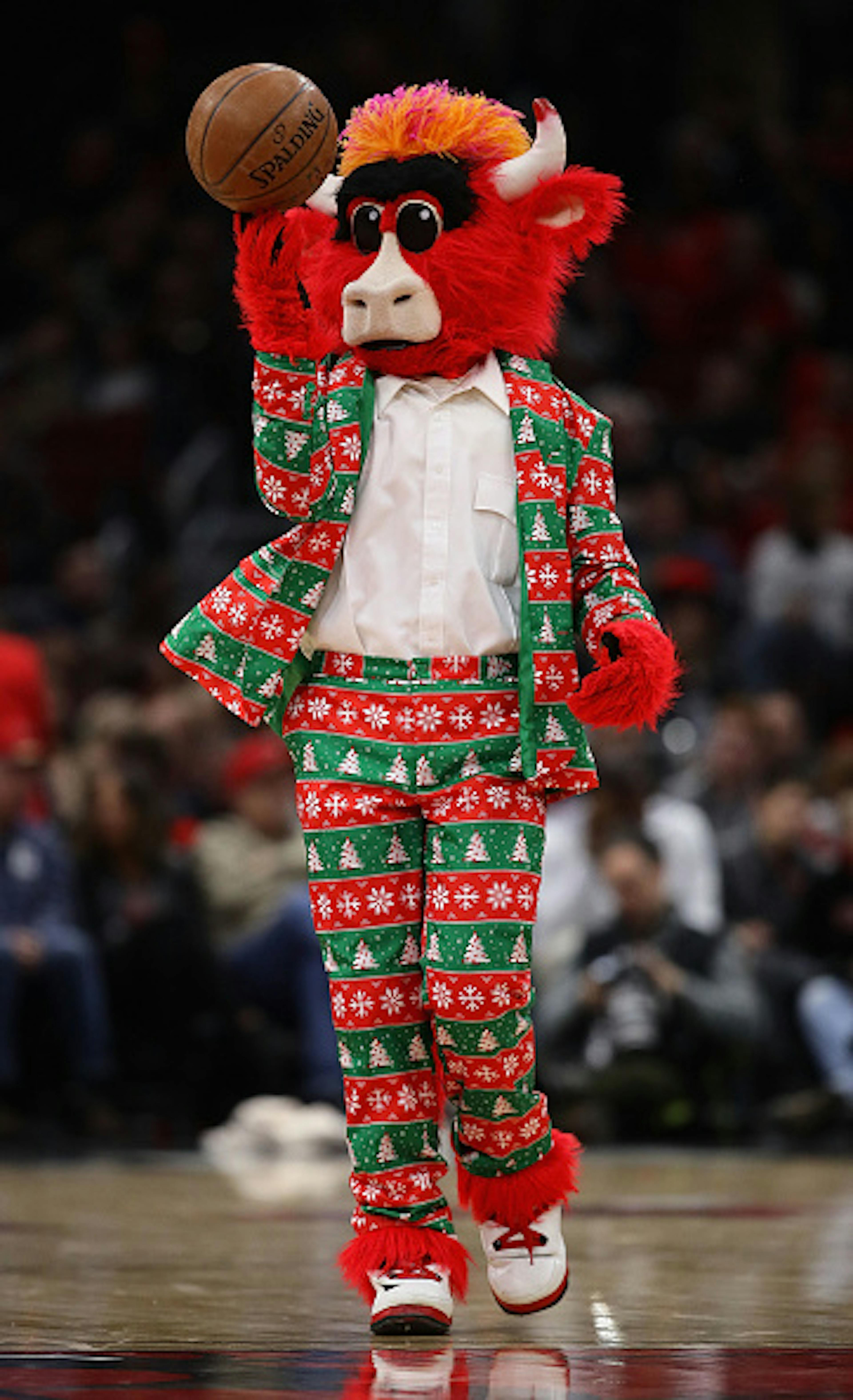 CHICAGO, ILLINOIS - DECEMBER 21: Chicago Bulls mascot Benny the Bull is dressed for Christmas as the Bulls take on the Orlando Magic at the United Center on December 21, 2018 in Chicago, Illinois. 
