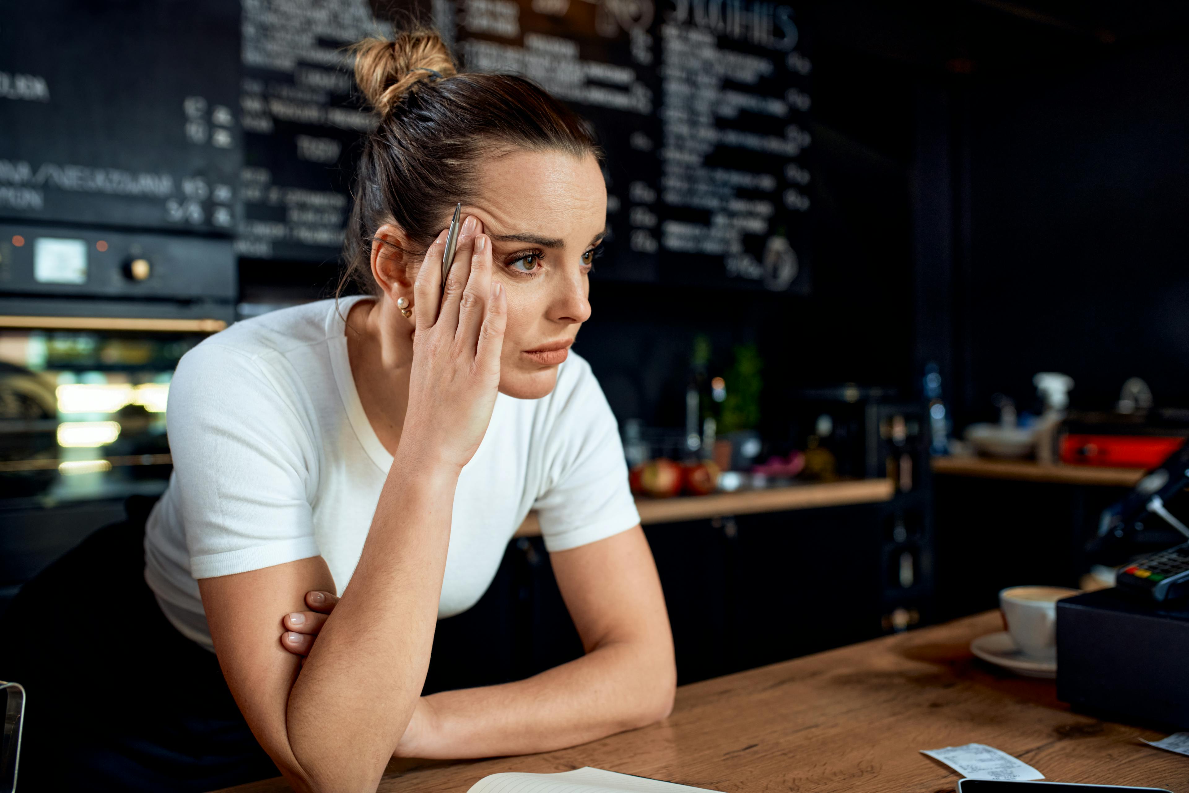 Frustrated small business owner in closed coffee shop