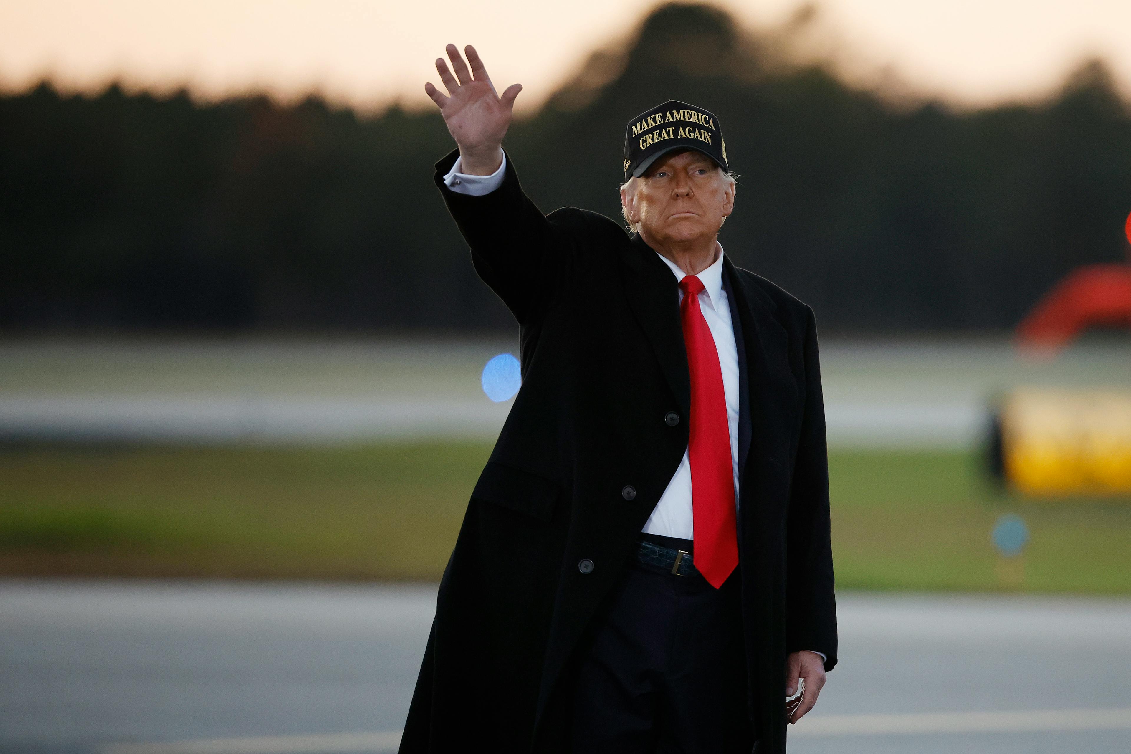 Trump waves sadly