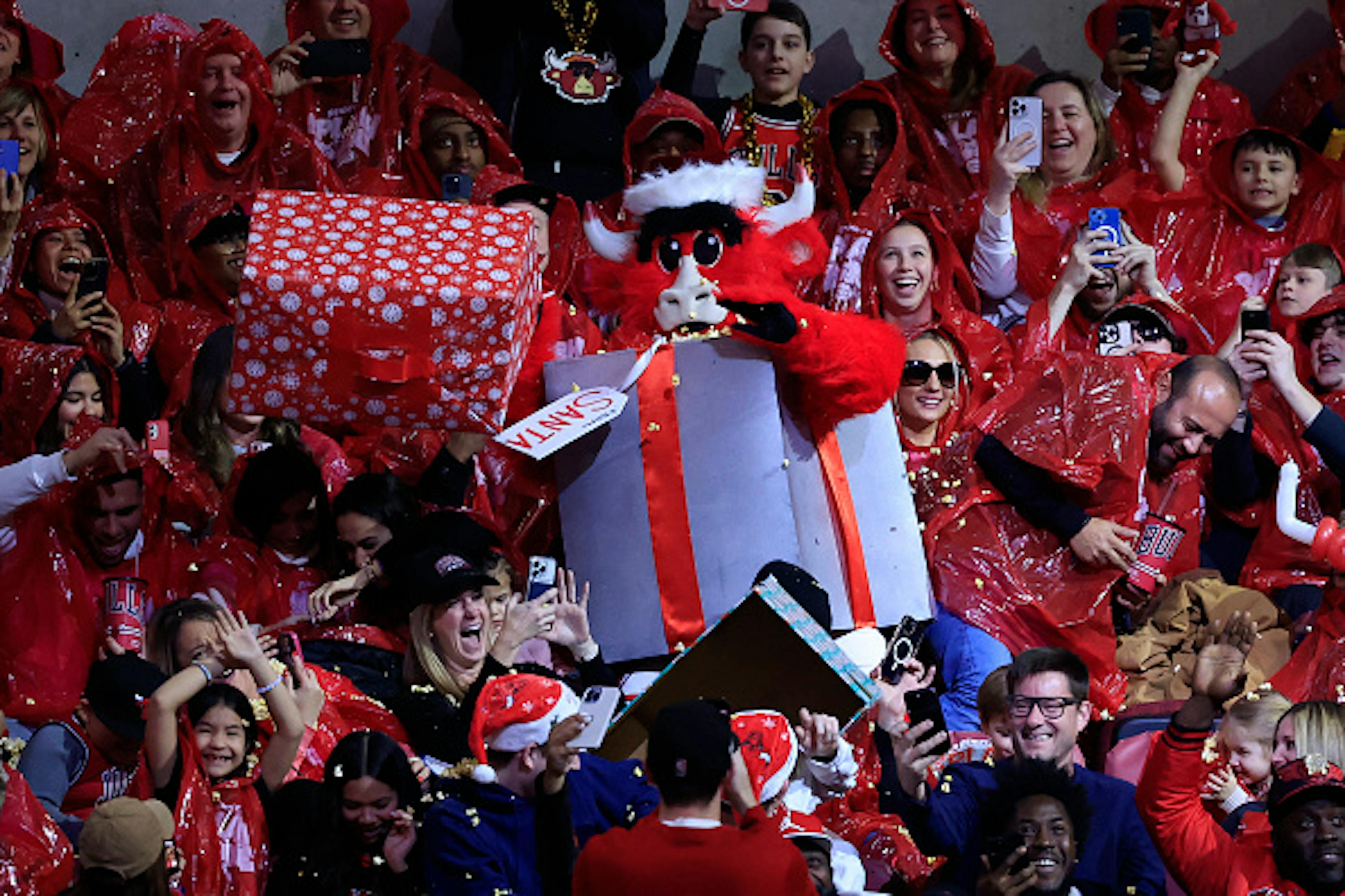 CHICAGO, ILLINOIS - DECEMBER 23: Benny the Bull, the Chicago Bulls mascot, dresses as Santa Claus in the game against the Milwaukee Bucks during the second half at the United Center on December 23, 2024 in Chicago, Illinois.