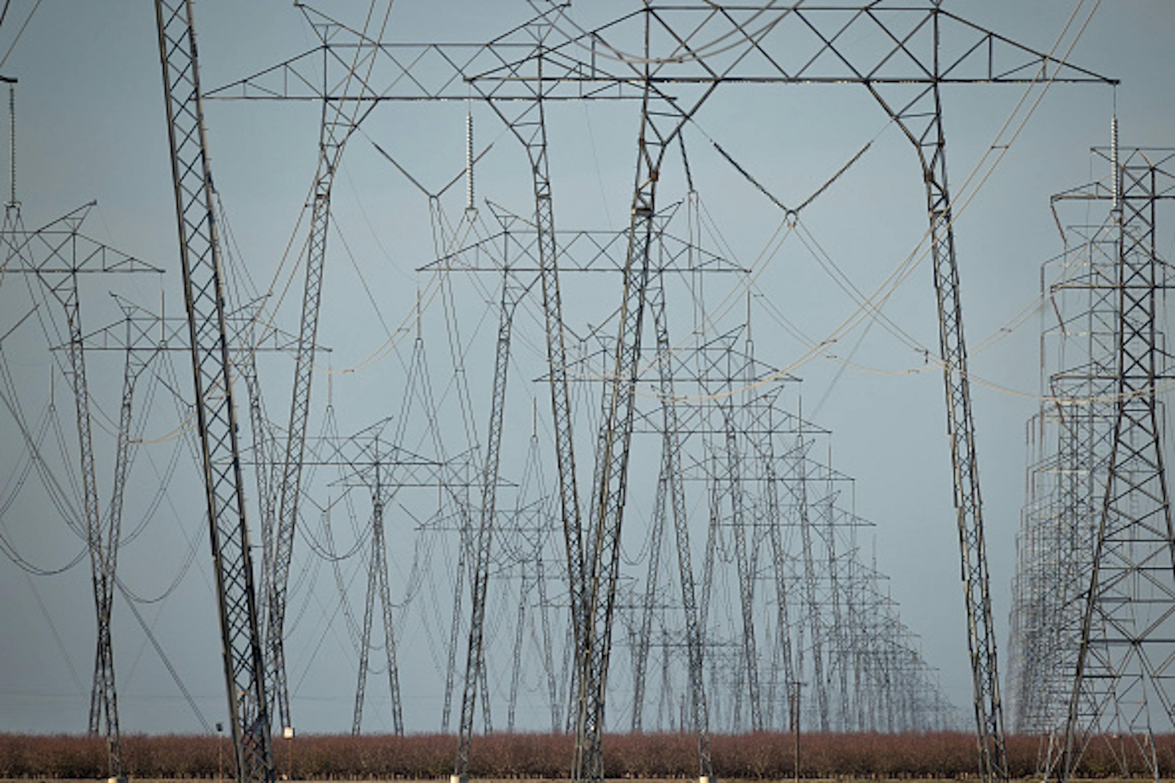 Transmission towers on a grey sky