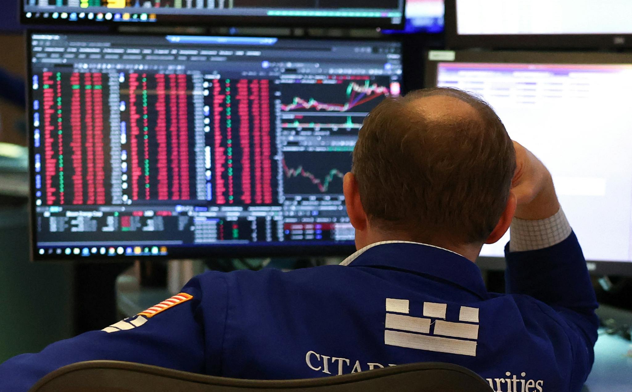 Trader red on screen bald dude