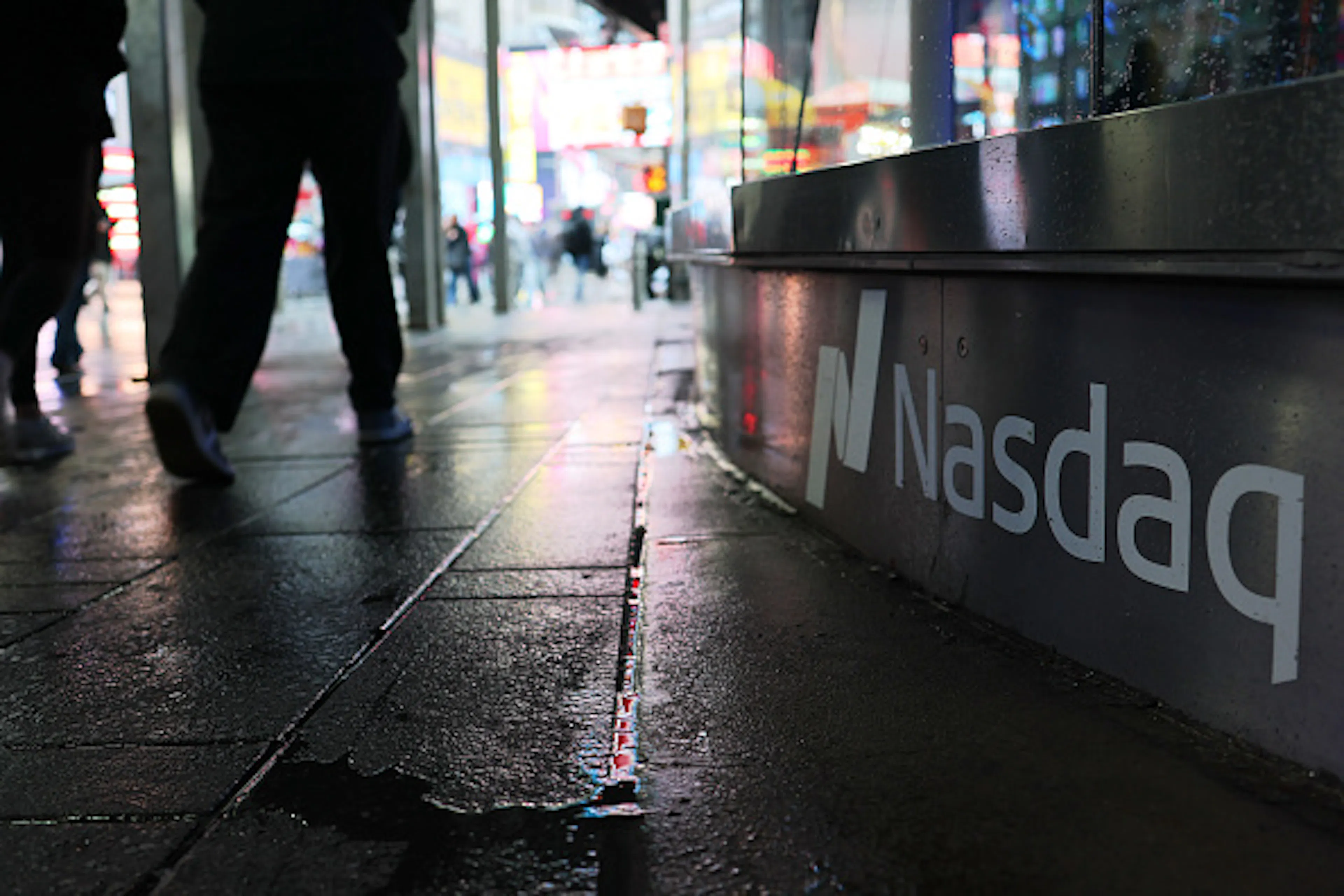 nasdaq sign on a city street pavement