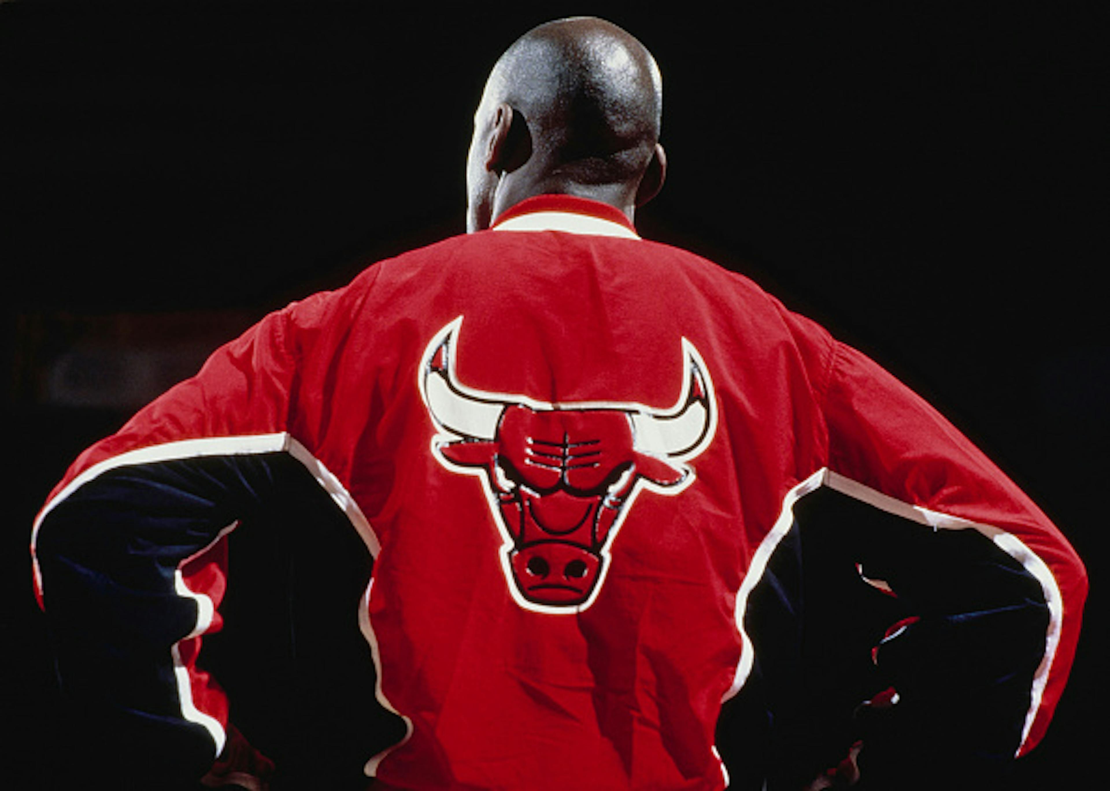Michael Jordan #23, Shooting Guard and Small Forward for the Chicago Bulls wearing a warm up jacket looks on during player introductions before the NBA Midwest Division basketball game against the Denver Nuggets 