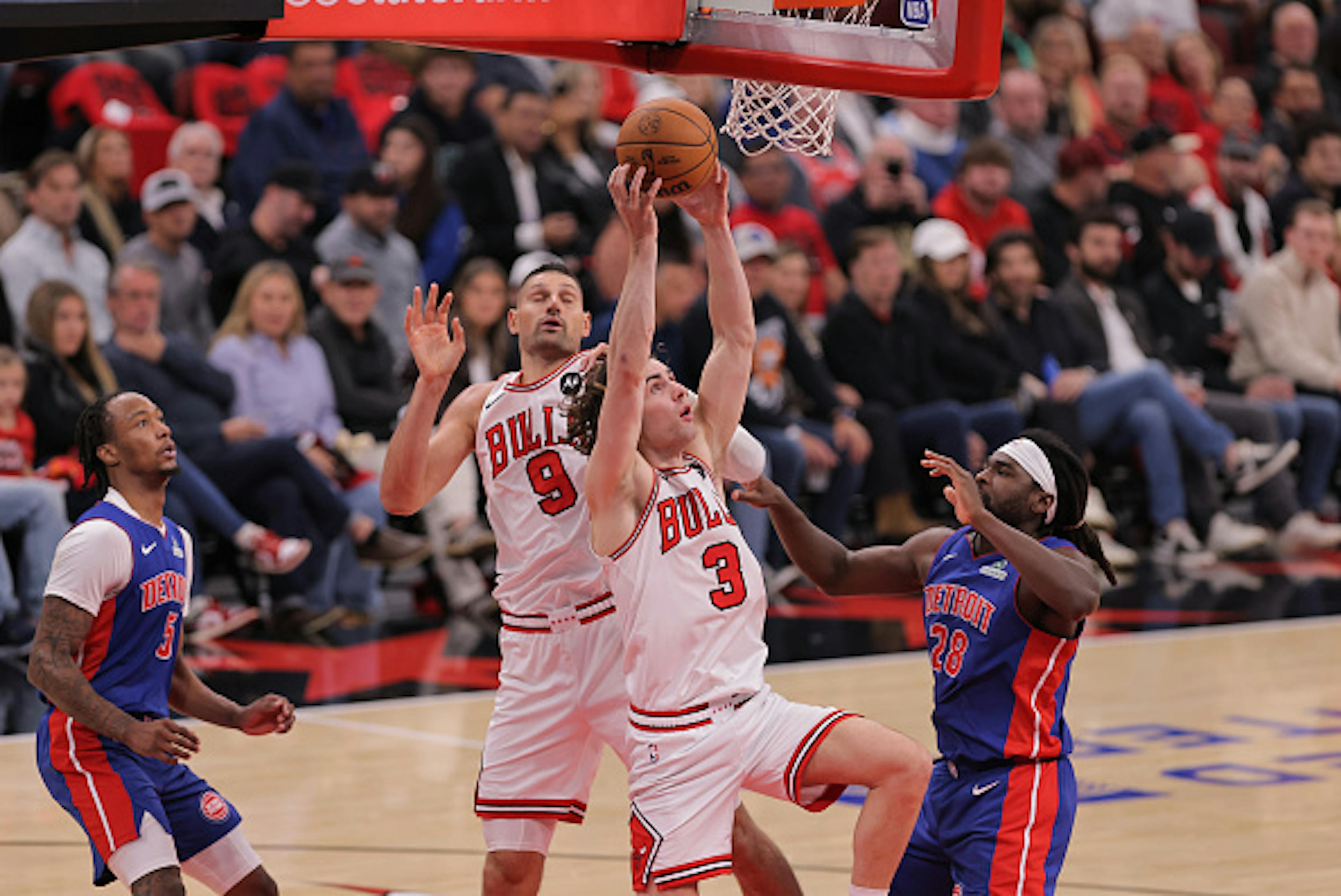 Josh Giddey #3 of the Chicago Bulls grabs a rebound during the second half against the Detroit Pistons on October 22, 2025 at the United Center in Chicago, Illinois. 