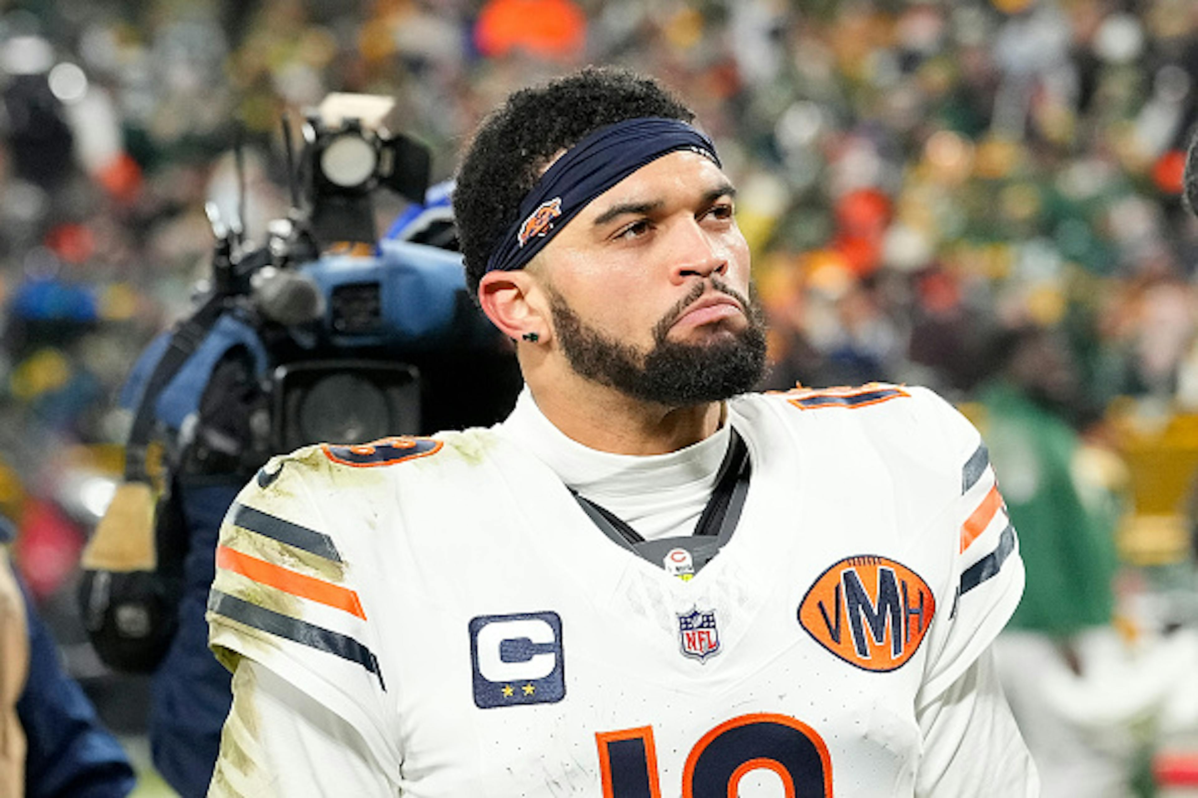 GREEN BAY, WISCONSIN - DECEMBER 07: Caleb Williams #18 of the Chicago Bears walks off the field after a loss to the Green Bay Packers at Lambeau Field on December 07, 2025 in Green Bay, Wisconsin. (Photo by John Fisher/Getty Images)