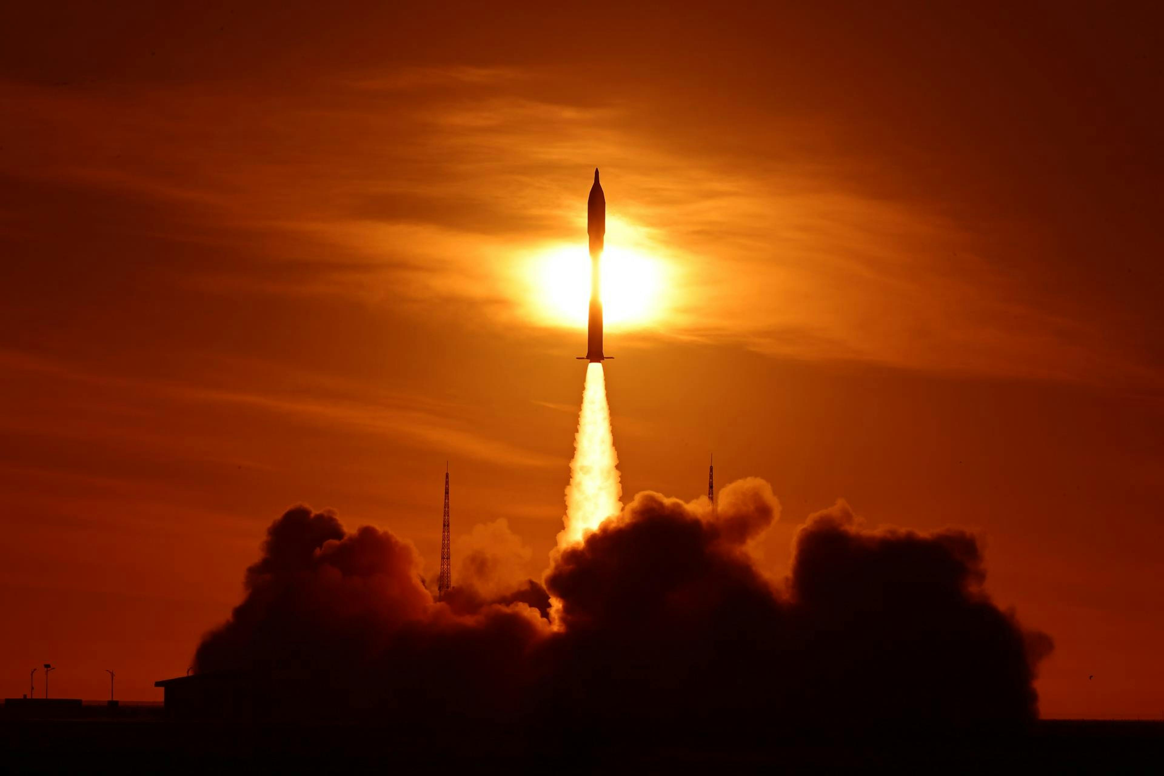 Rocket launching at sunset