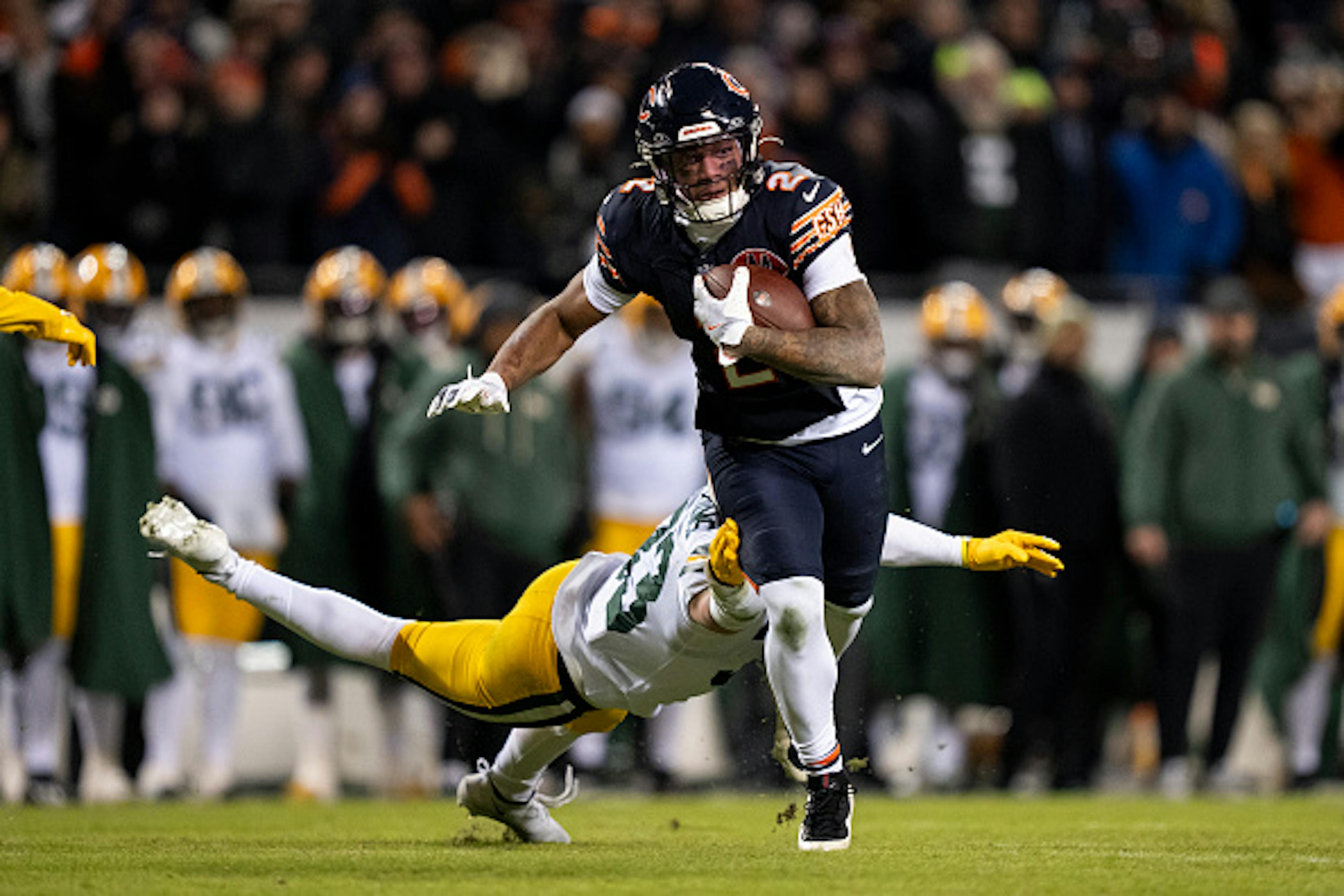 CHICAGO, ILLINOIS - JANUARY 10: DJ Moore #2 of the Chicago Bears runs with the ball during an NFL wild card playoff game against the Green Bay Packers at Soldier Field on January 10, 2026 in Chicago, Illinois.
