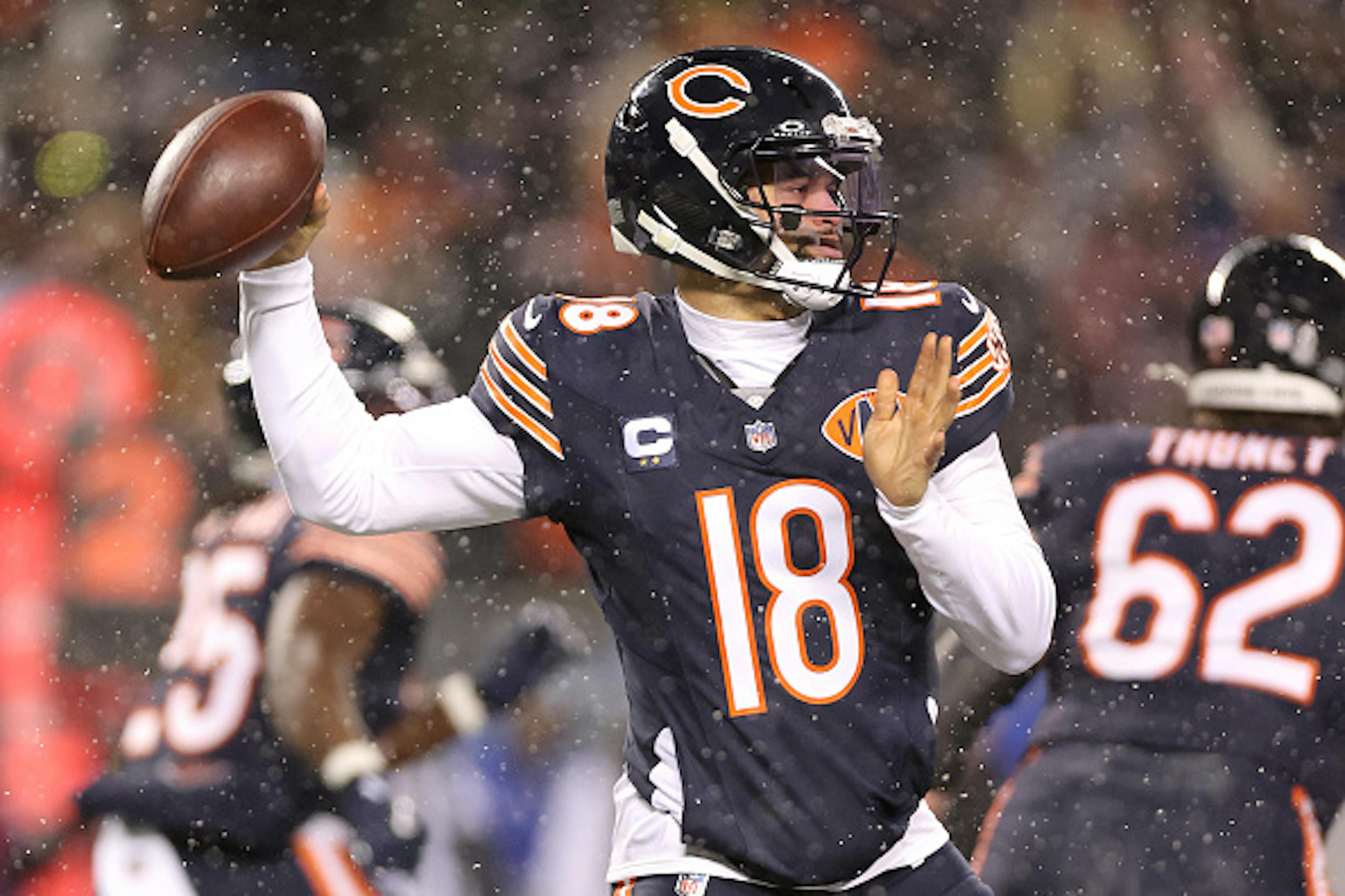 CHICAGO, ILLINOIS - JANUARY 18: Caleb Williams #18 of the Chicago Bears throws a pass against the Los Angeles Rams during the first quarter in the NFC Divisional Playoffs at Soldier Field on January 18, 2026 in Chicago, Illinois. 