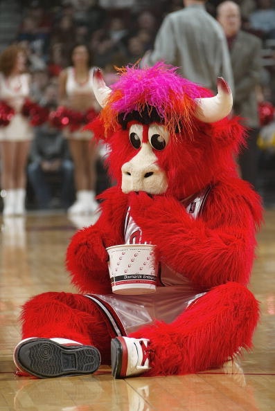 CHICAGO - DECEMBER 13: Benny the Bull, the mascot of the Chicago Bulls, eats popcorn during the game against the Dallas Mavericks on December 13, 2004 at the United Center in Chicago, Illinois. 