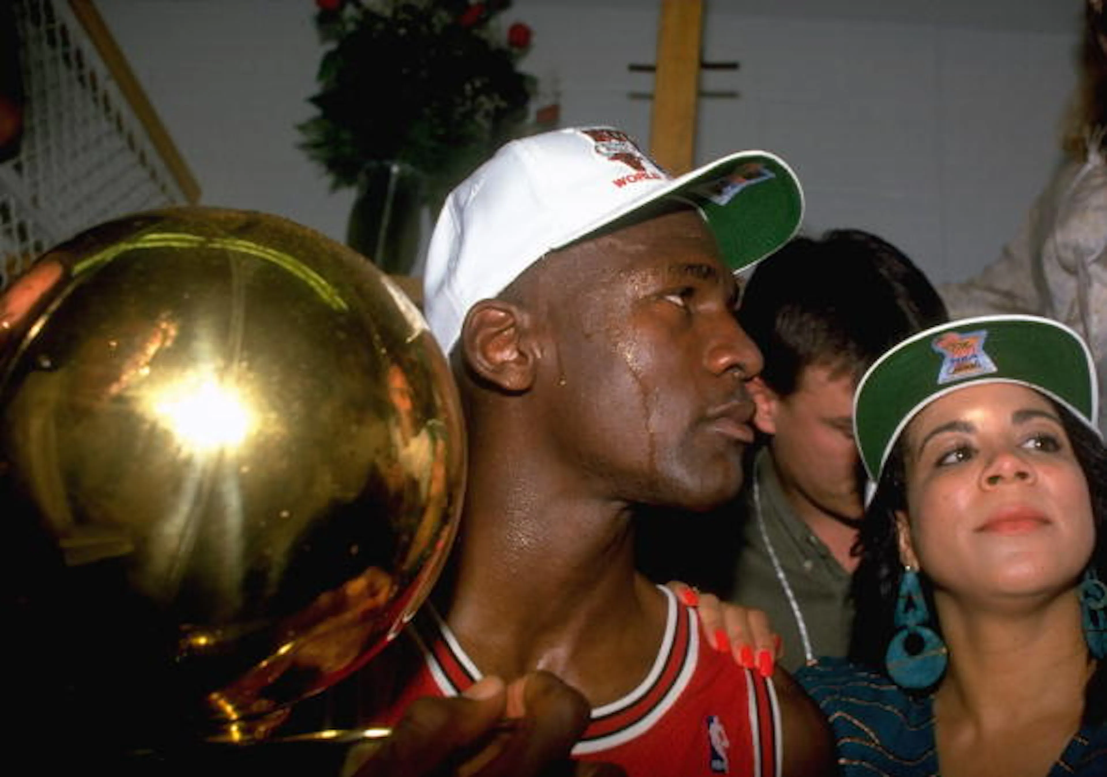 UNITED STATES - JUNE 12: Basketball: finals, Closeup of Chicago Bulls Michael Jordan victorious with wife Juanita and trophy after game vs Los Angeles Lakers, Los Angeles, CA 6/12/1991