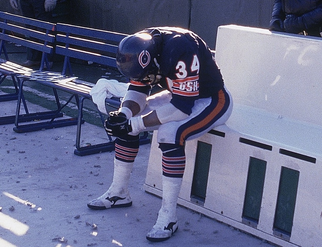 NFC Playoffs: Chicago Bears Walter Payton (34) upset, sitting on sidelines bench after losing game vs Washington Redskins