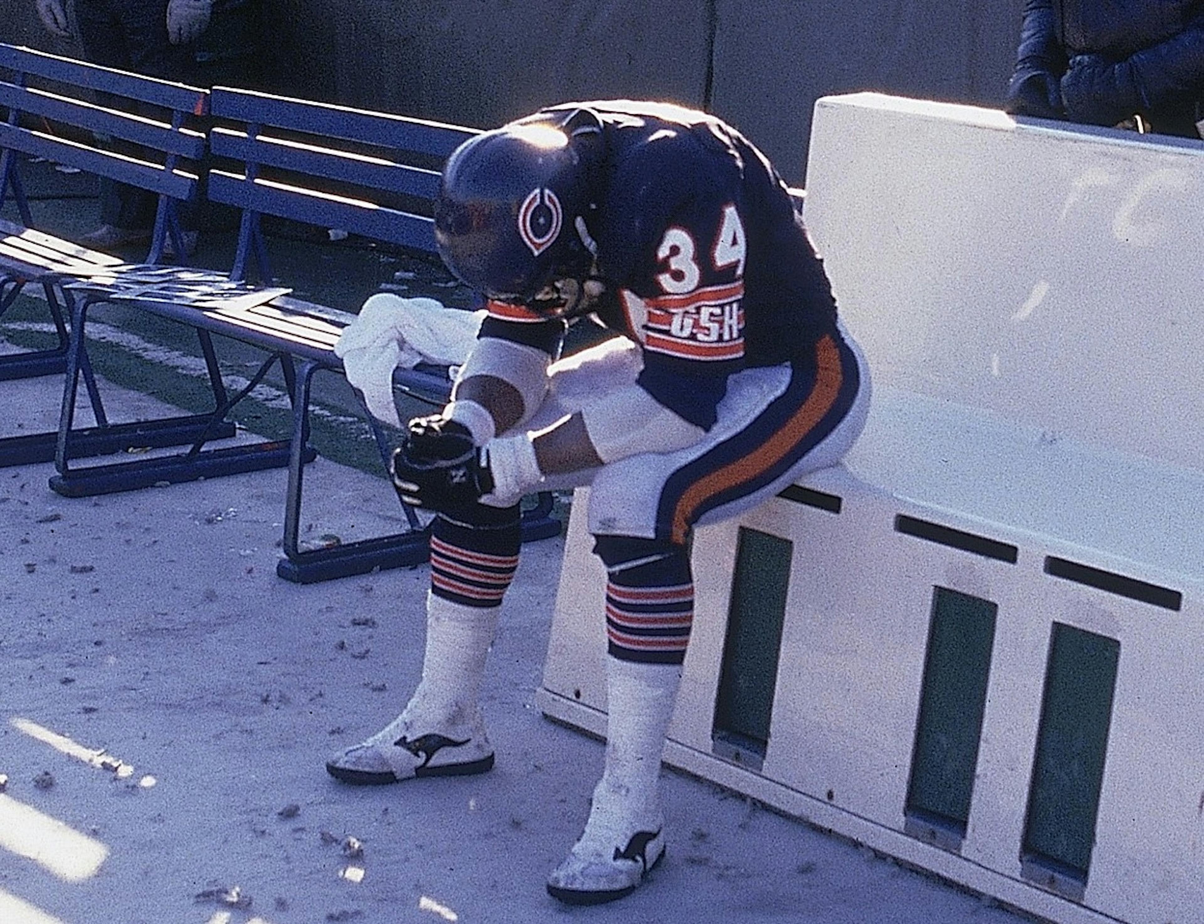 NFC Playoffs: Chicago Bears Walter Payton (34) upset, sitting on sidelines bench after losing game vs Washington Redskins