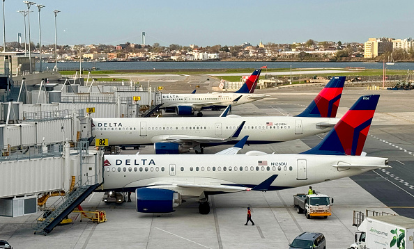 Delta airplanes in an airport runway