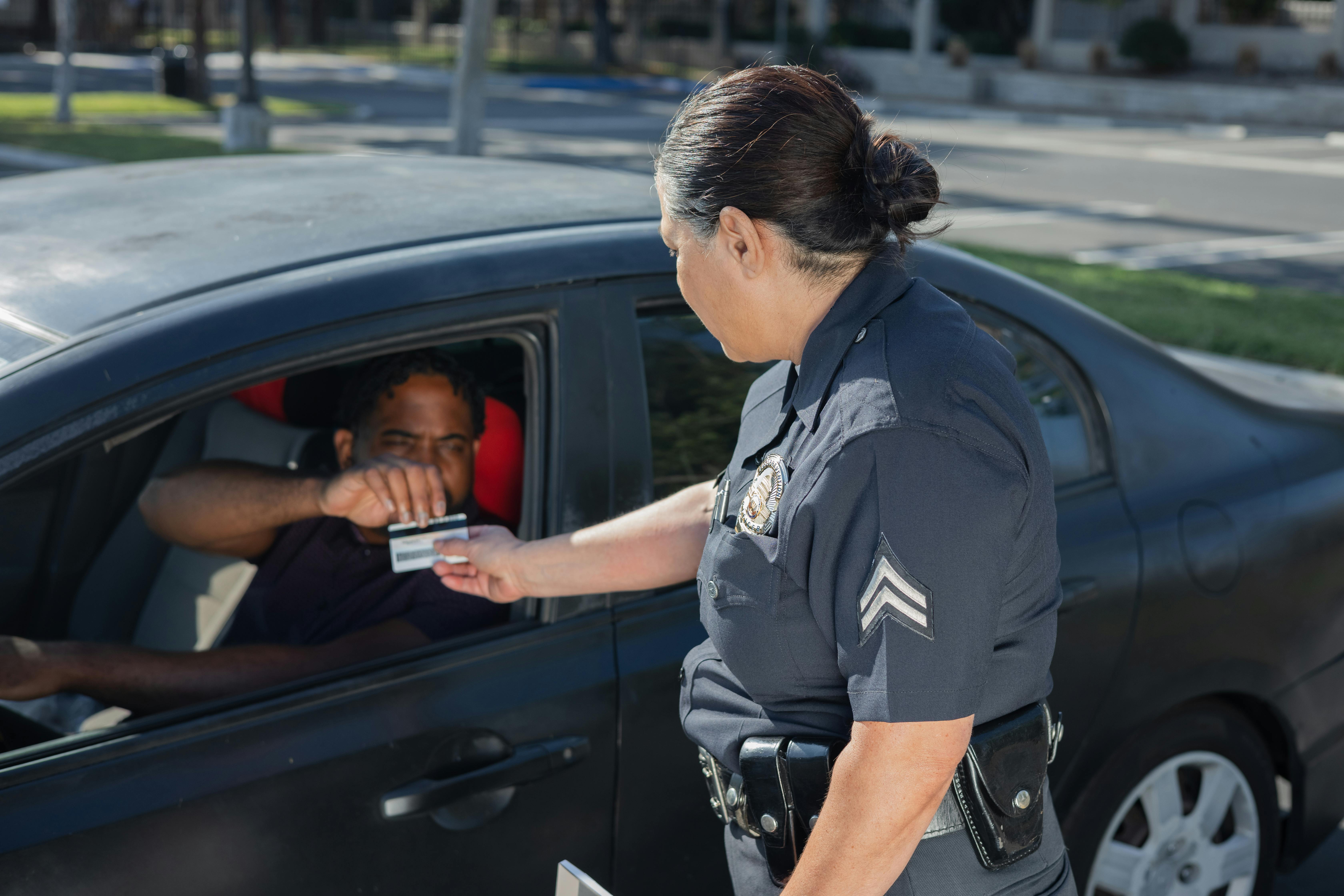 Police officer checking ID