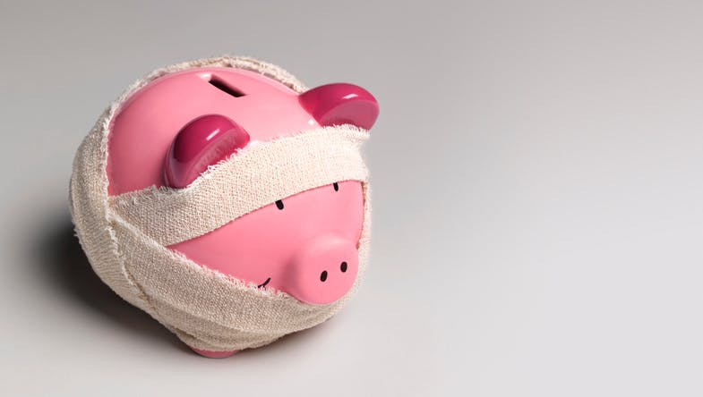 Piggy bank with bandages