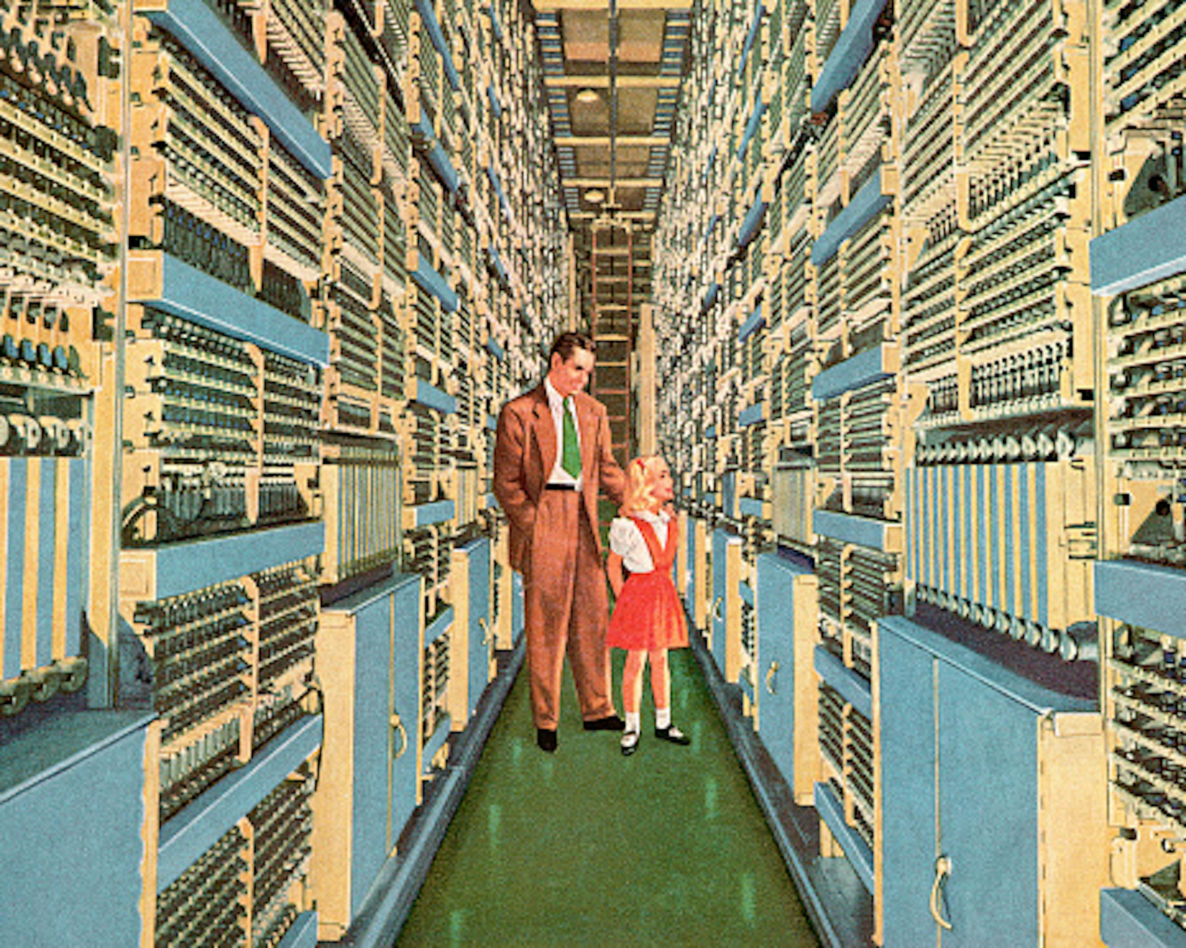 Man and Girl Walking Through Aisle of Computers