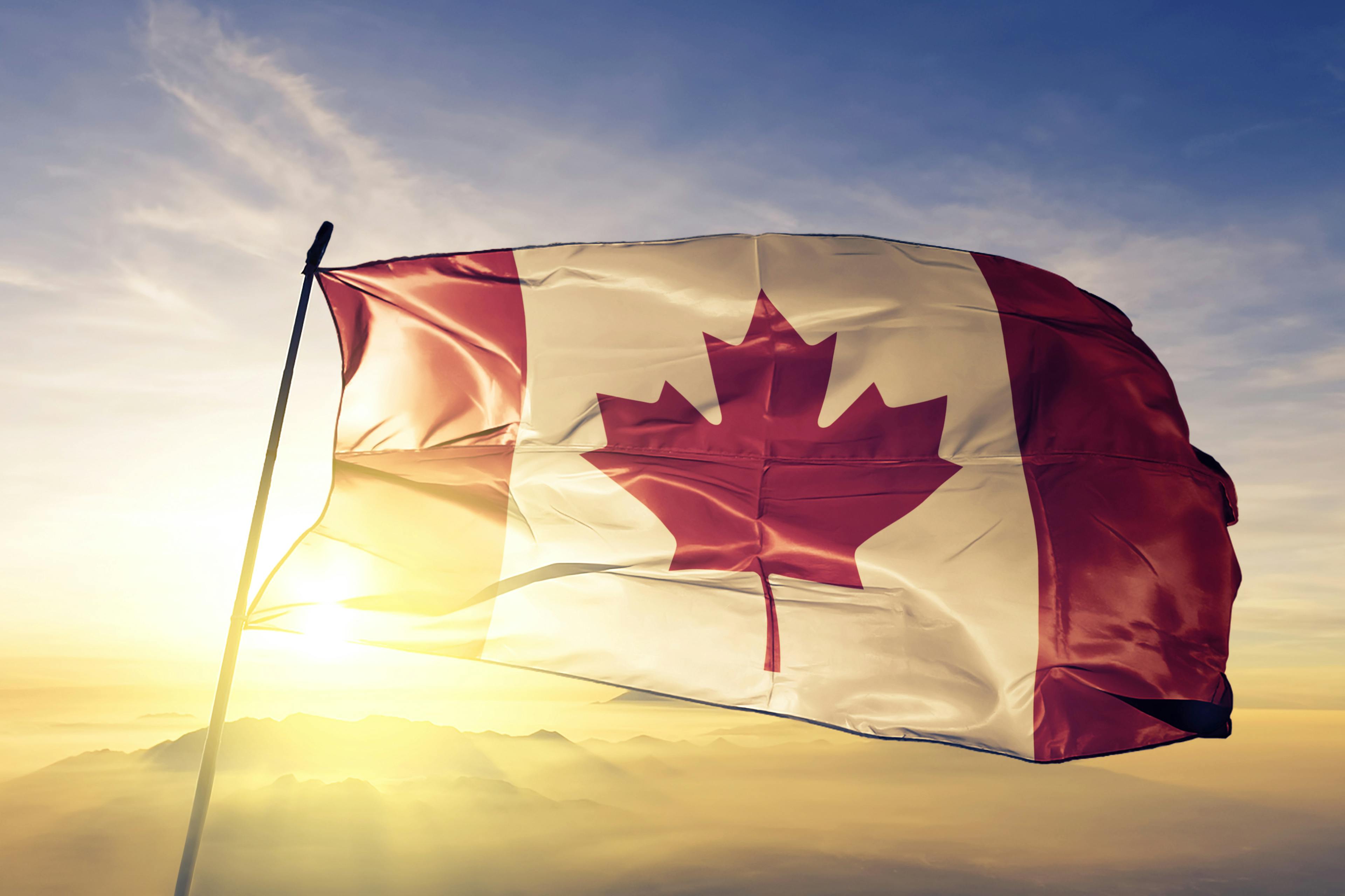 Canadian flag in the sunrise