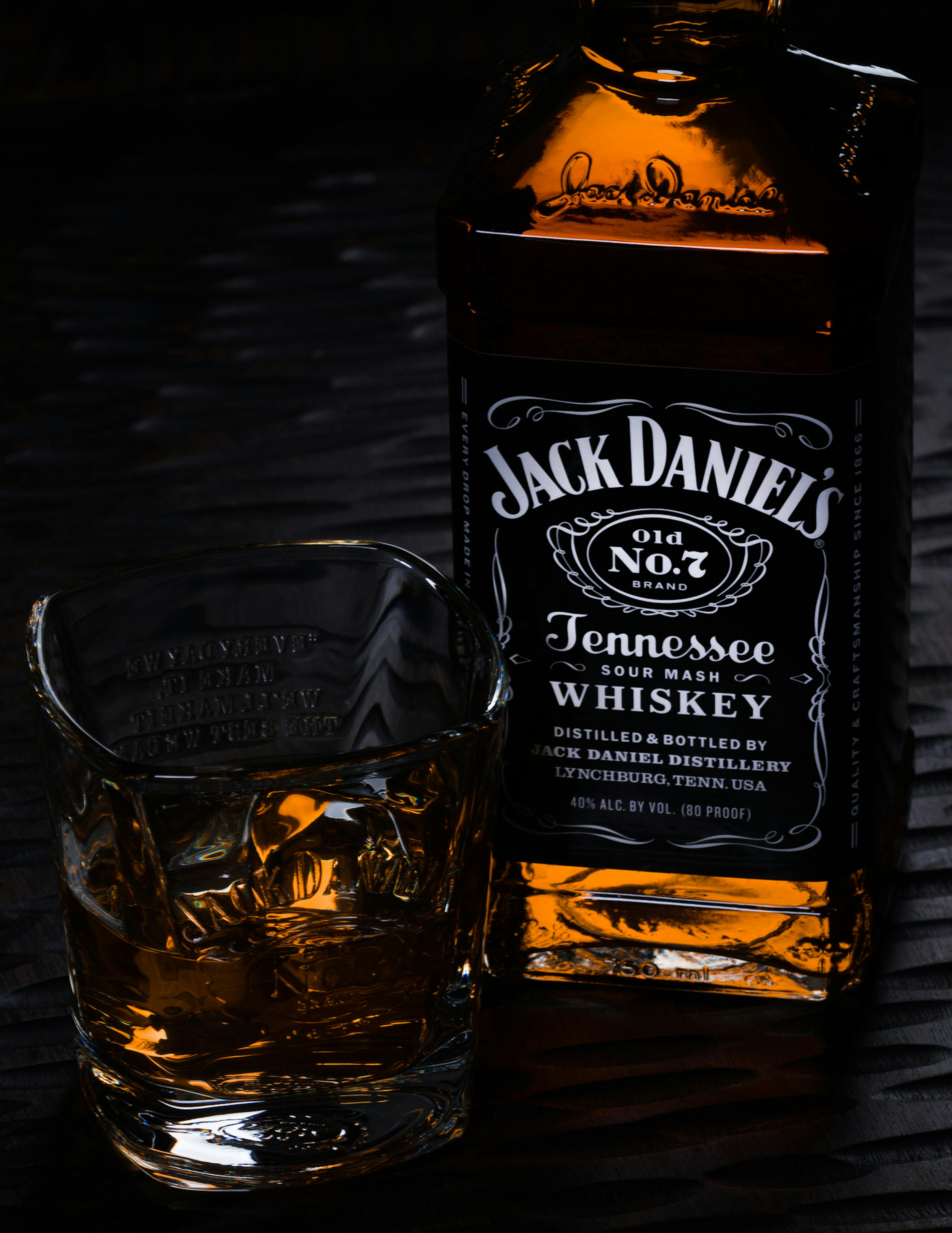 Jack Daniels bottle with glass