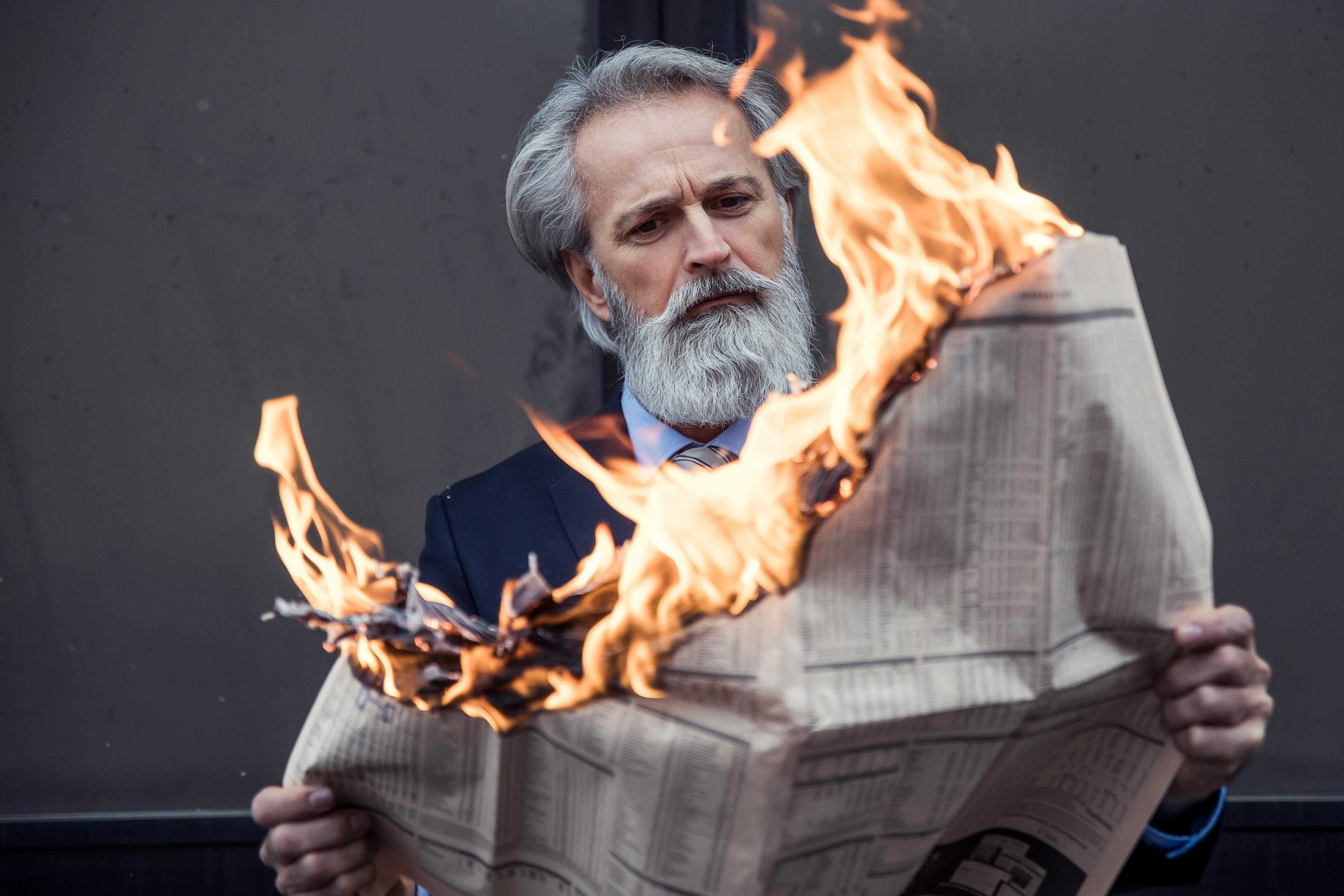 Newspaper in fire