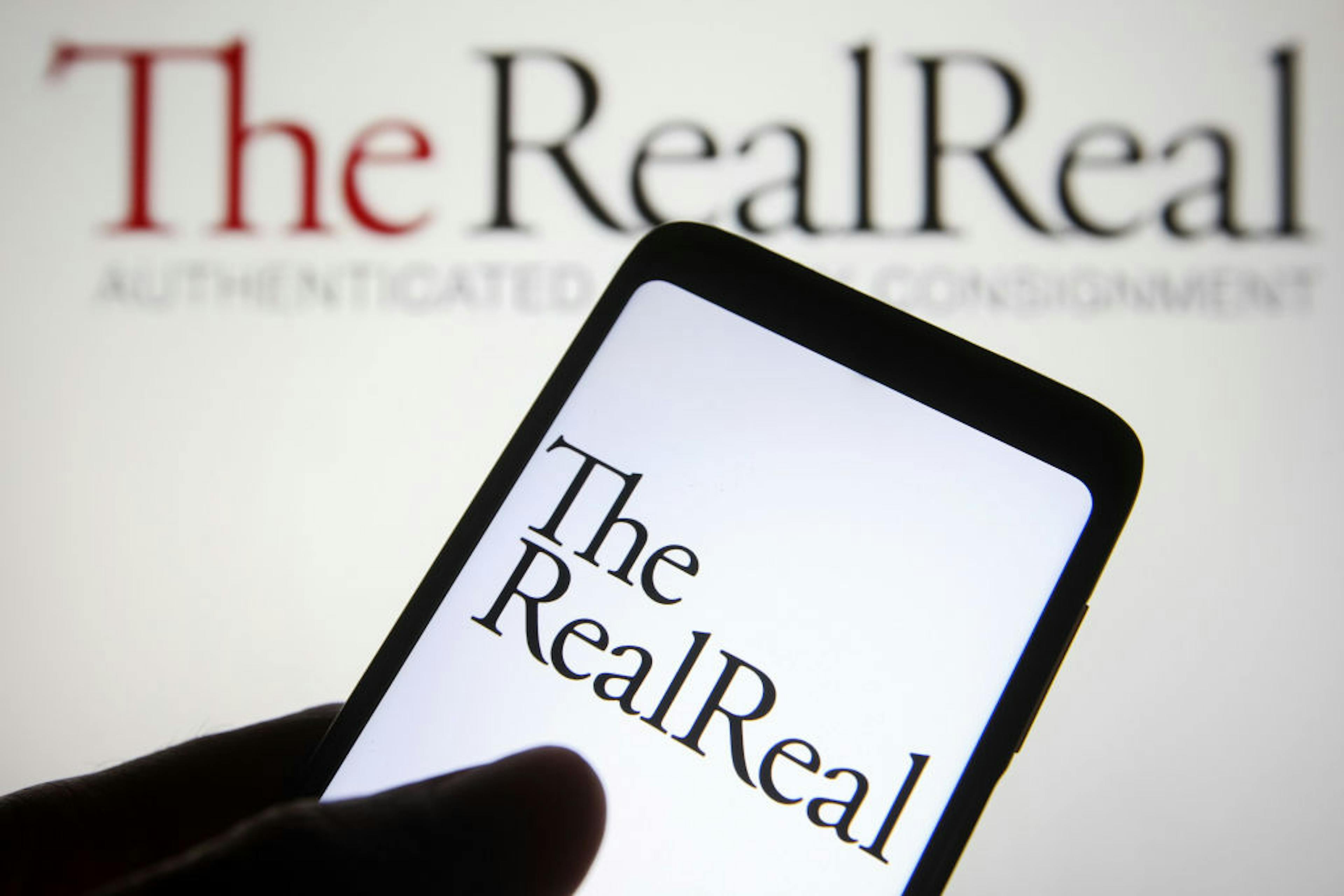In this photo illustration, The RealReal Inc. logo is seen...