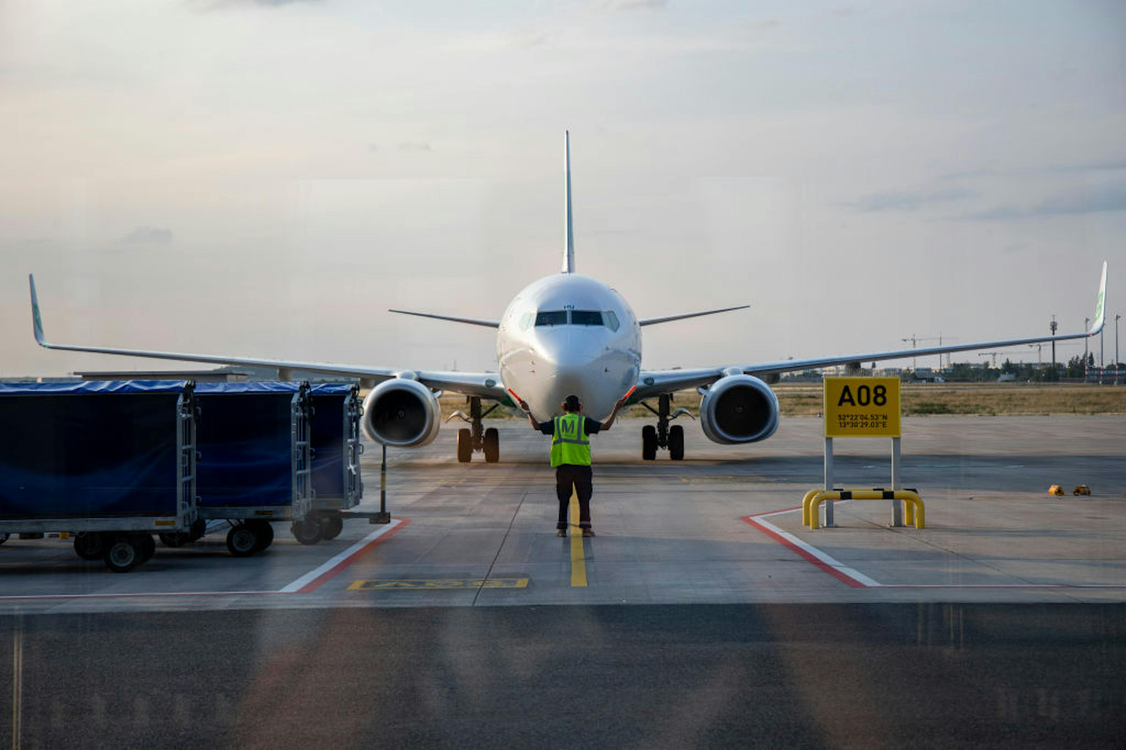 Air marshaller waving in a plane