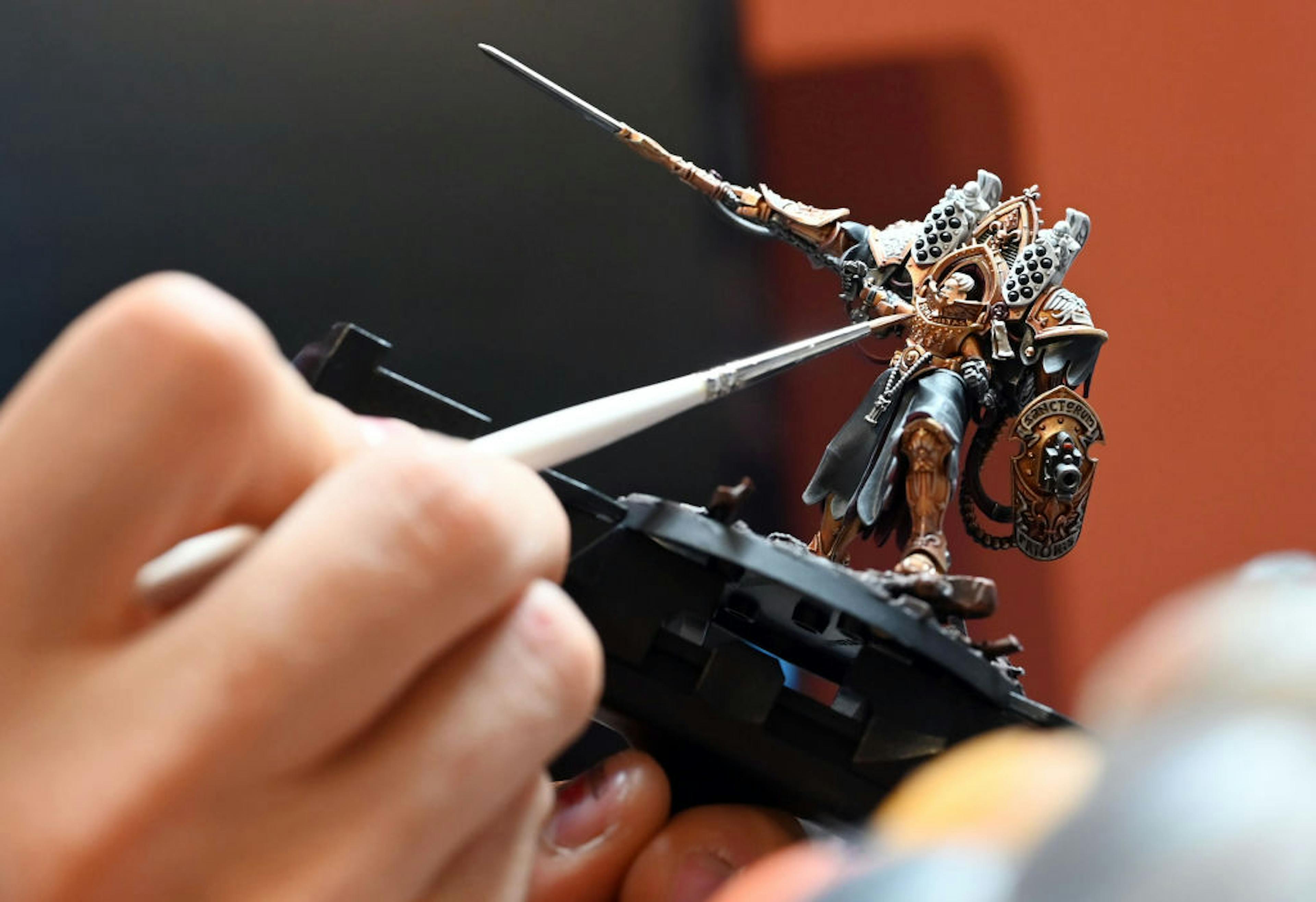 A “Warhammer” figuring being painted.