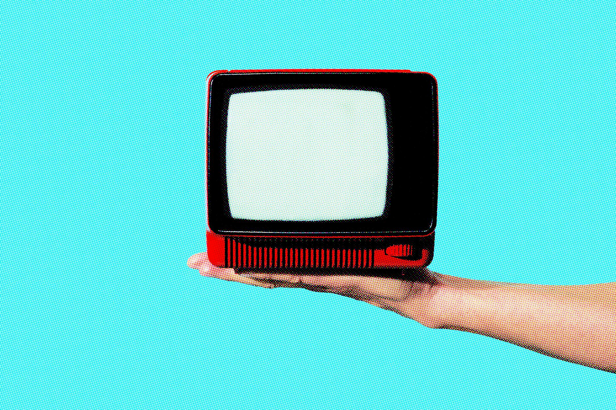 man has an old analog television set