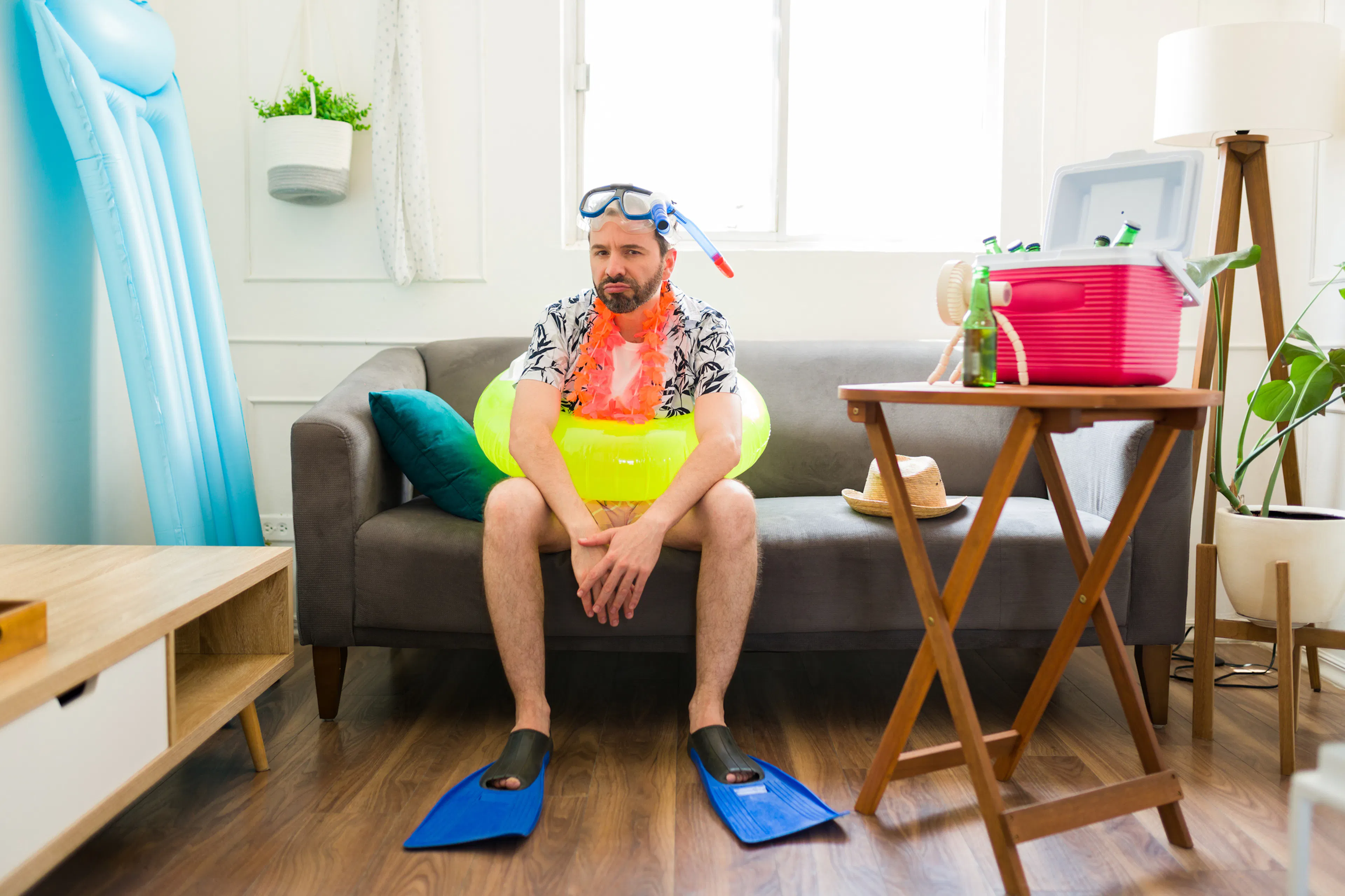 Bored annoyed man looking funny and angry during his summer staycations