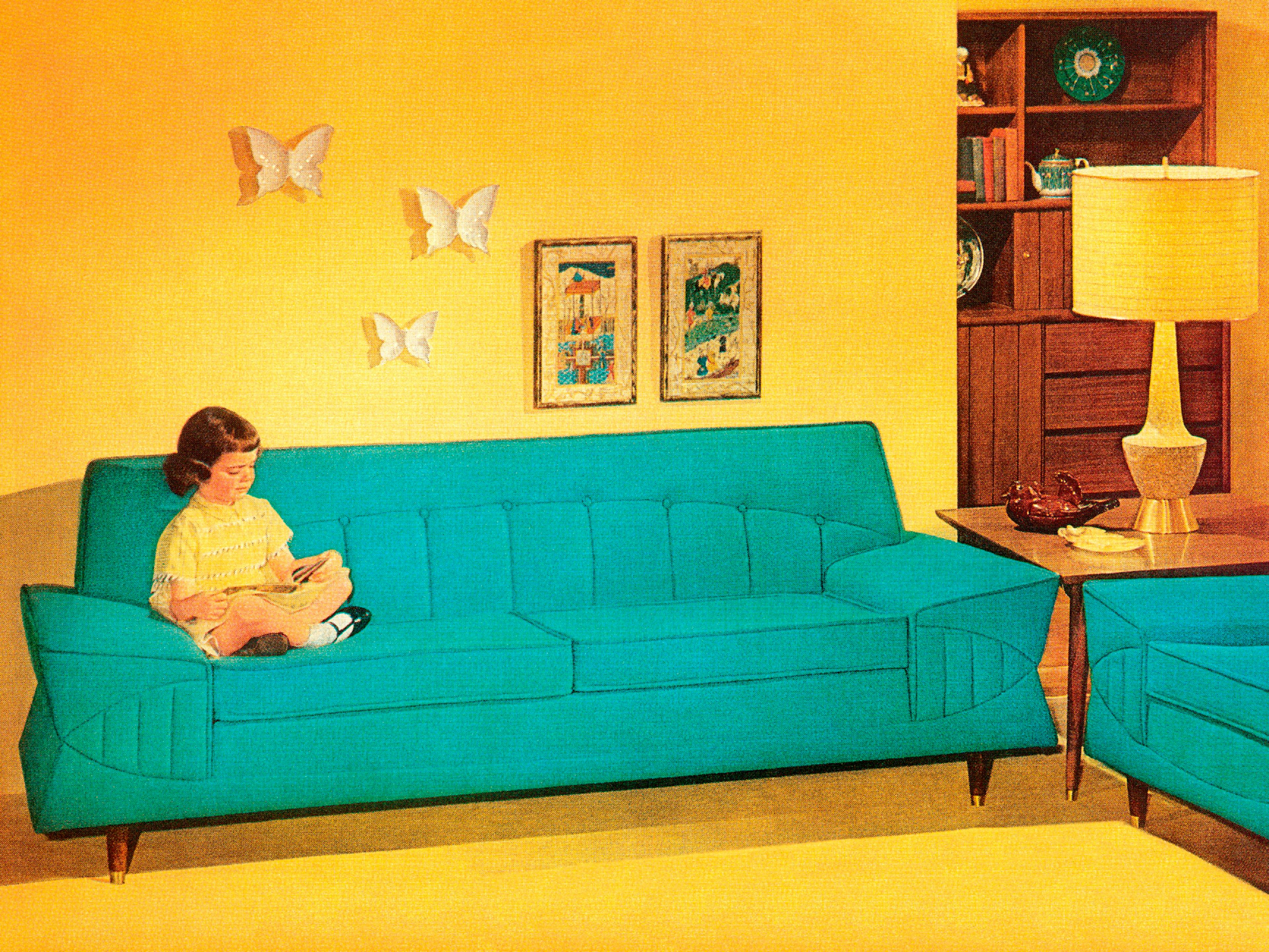 Girl Reading On Turquoise Couch
