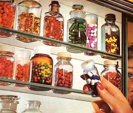 Woman’s Hand in Medicine Cabinet
