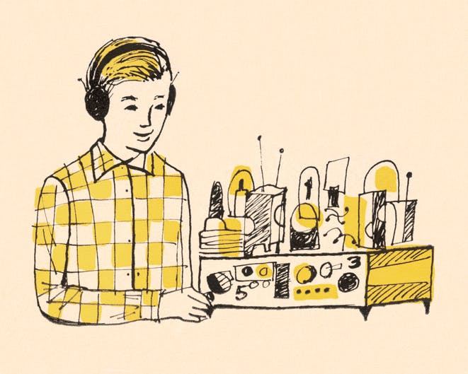 Boy Wearing Headphones and Using Radio