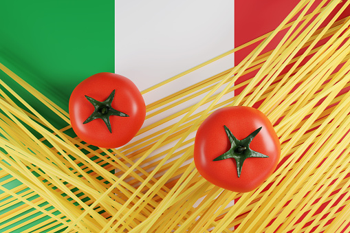 Uncooked (raw) spaghetti and tomatoes on the national flag of Italy. Illustration of the concept of Italian cuisine and pasta
