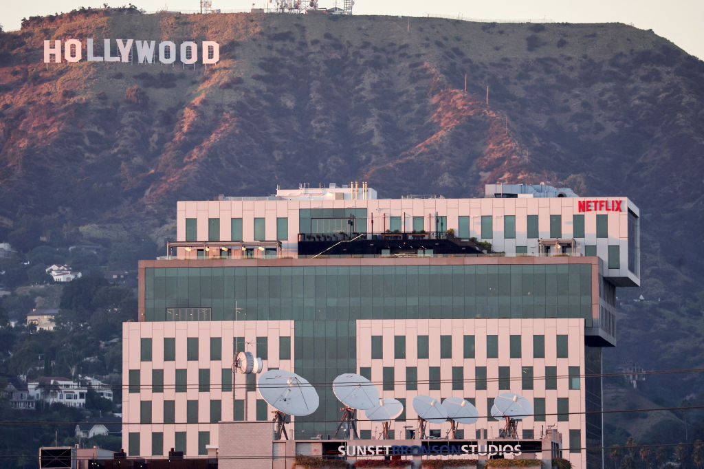 The Hollywood sign and Netflix logo in LA