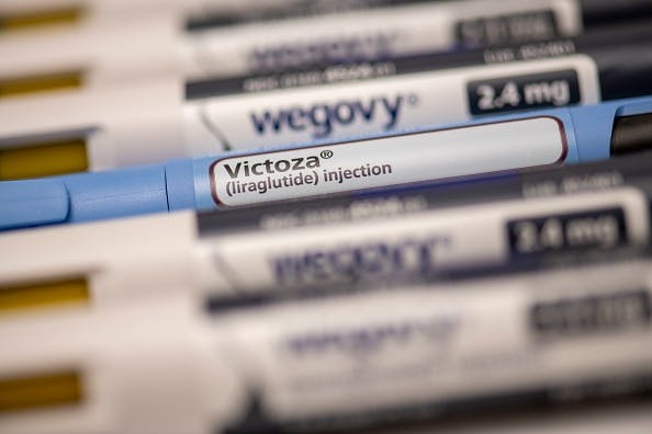 Still life of Victoza and Wegovy. Both are injectable prescription weight loss medicines.
