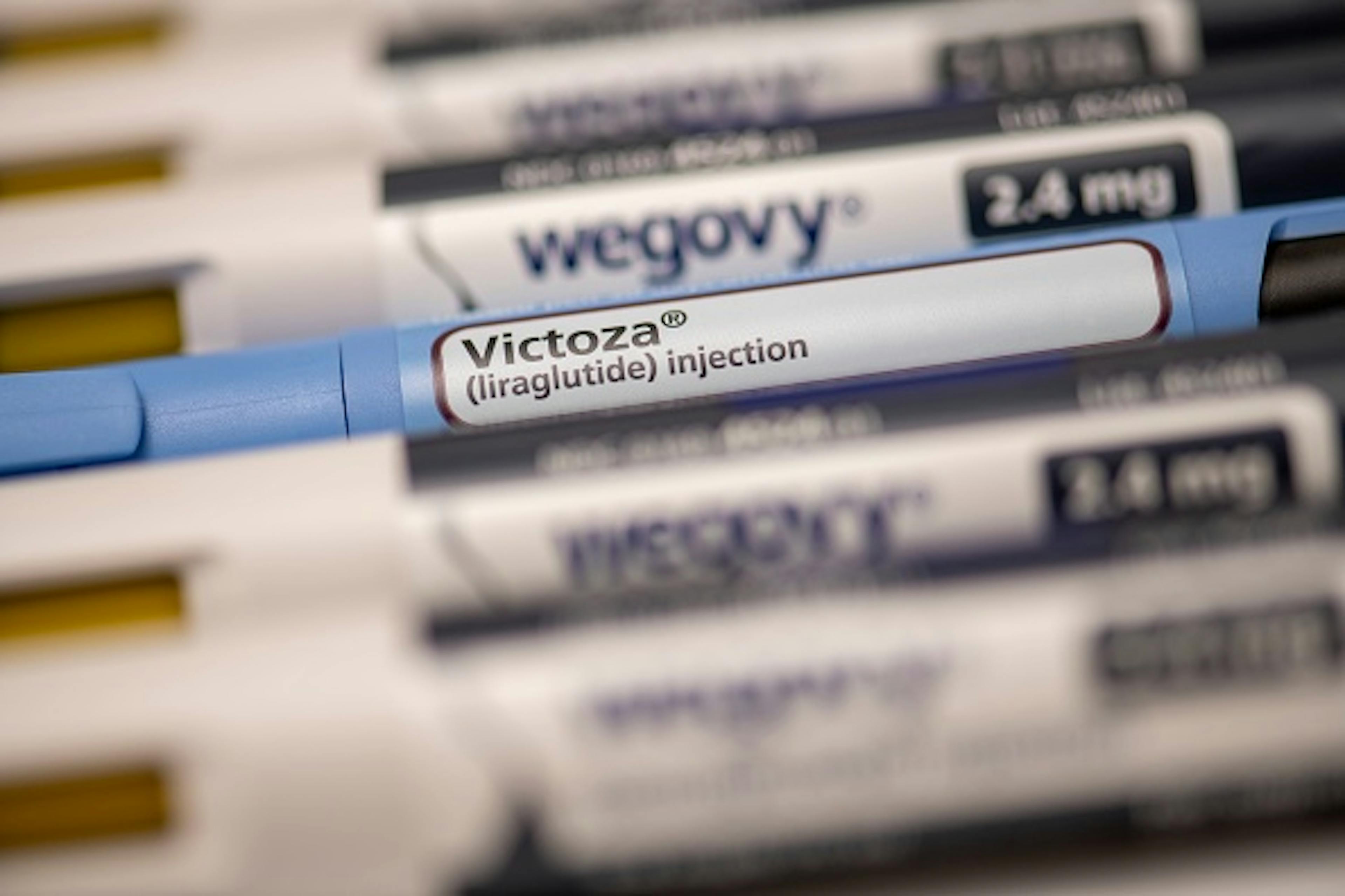 Still life of Victoza and Wegovy. Both are injectable prescription weight loss medicines.