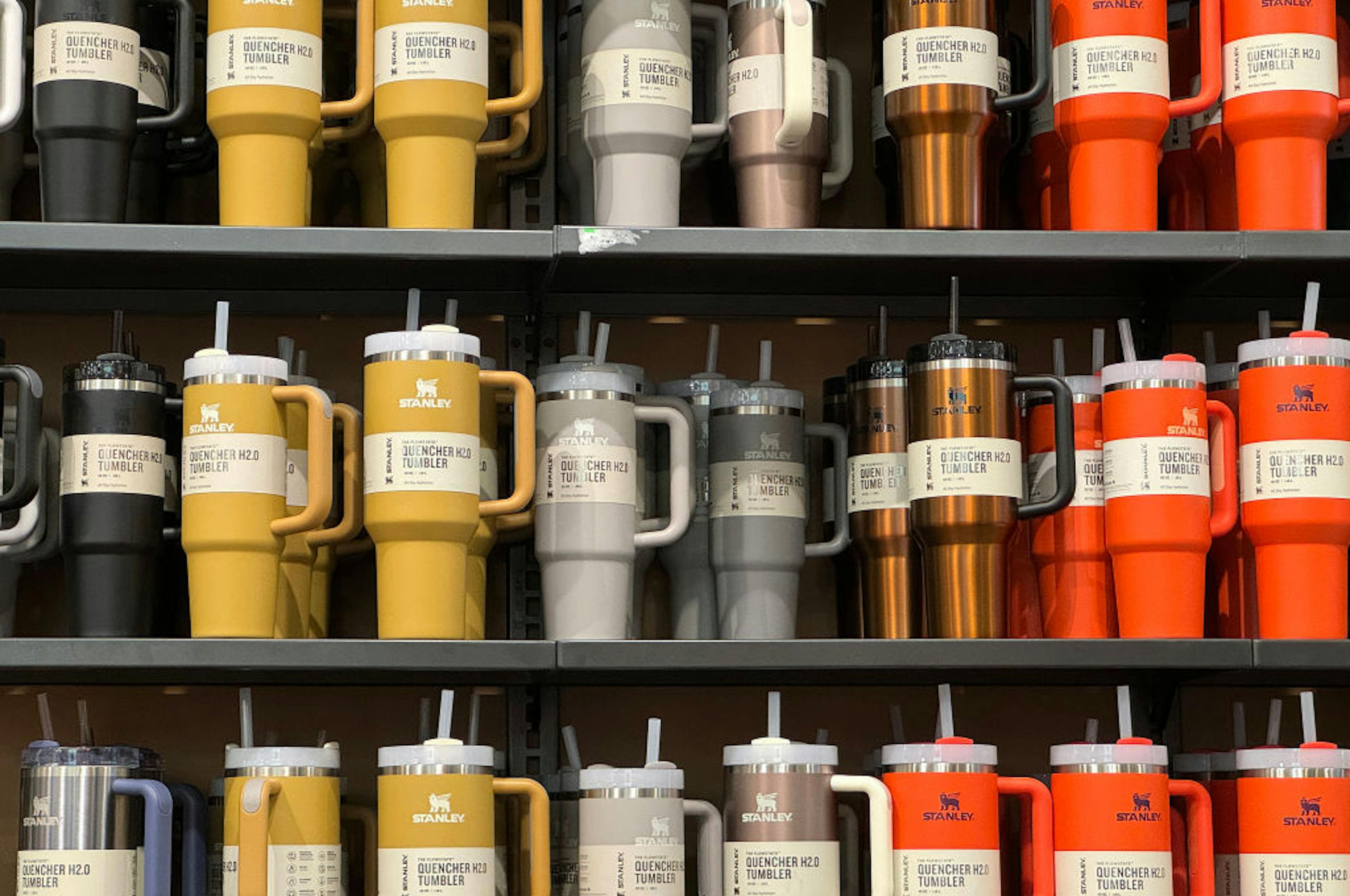 Stanley tumblers are displayed on a shelf at a Dick's Sporting Goods