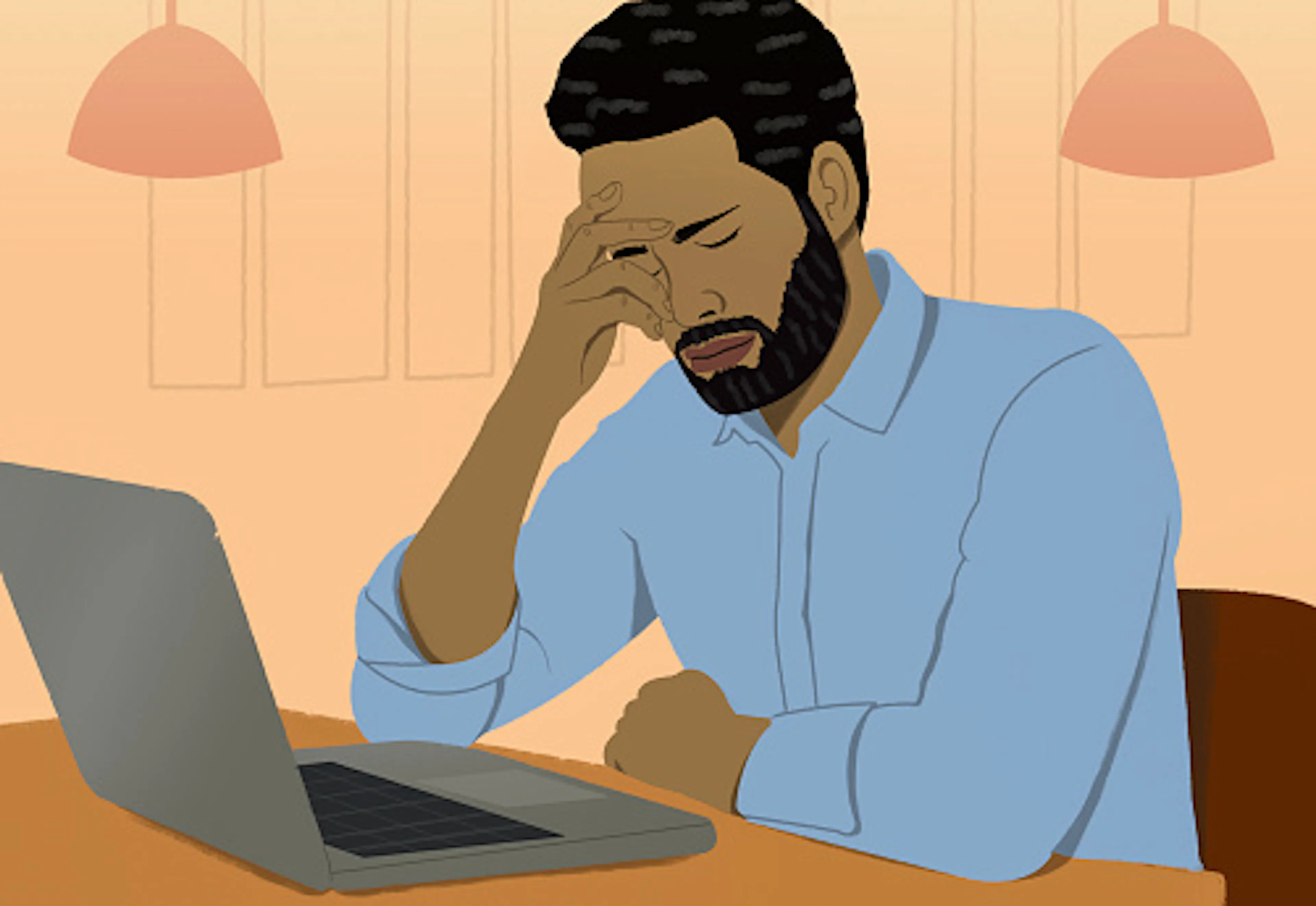 Frustrated man working from home at laptop