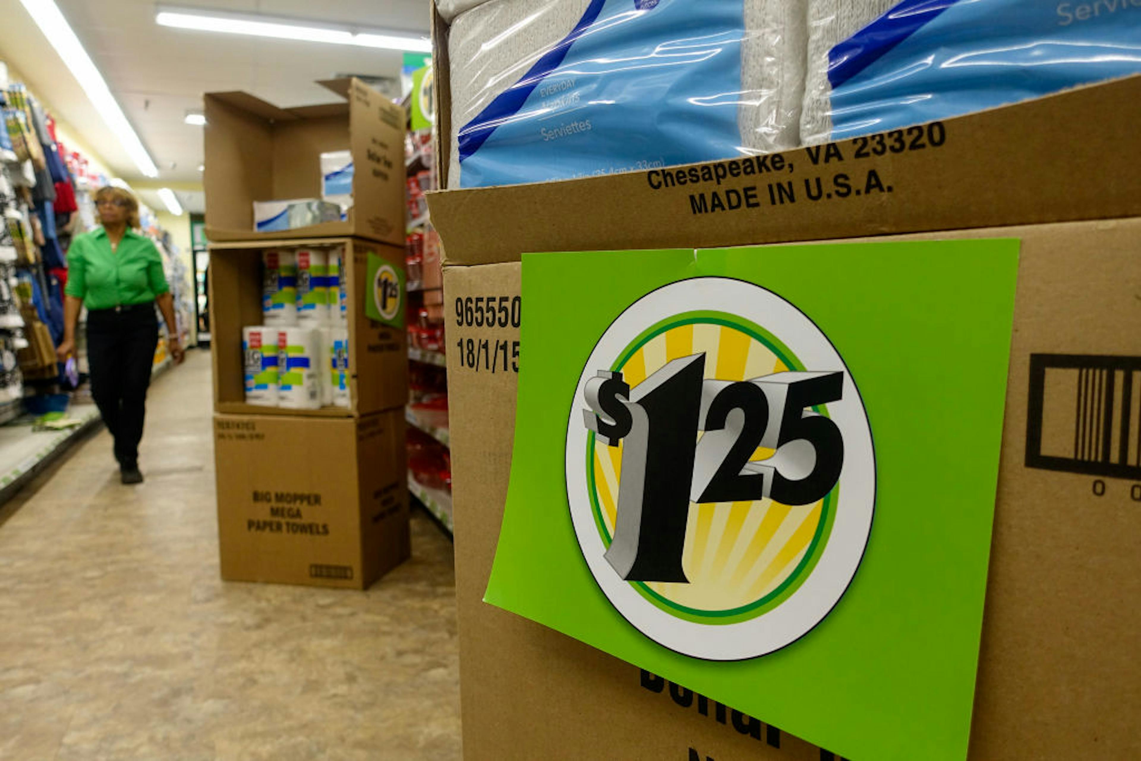 Inside a Dollar Tree store, where a price tag shows $1.25.