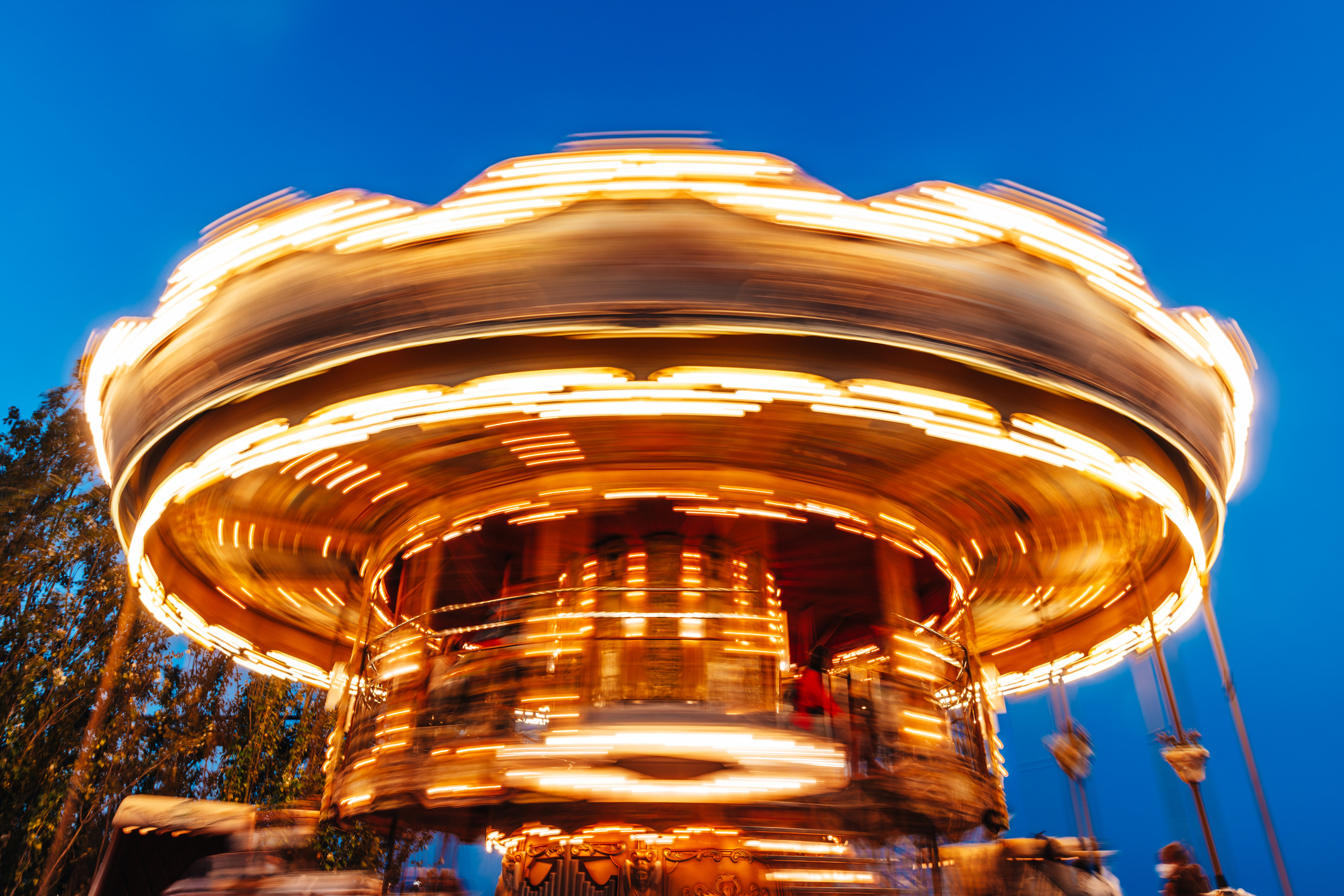 Carousel at an amusement park spinning at night