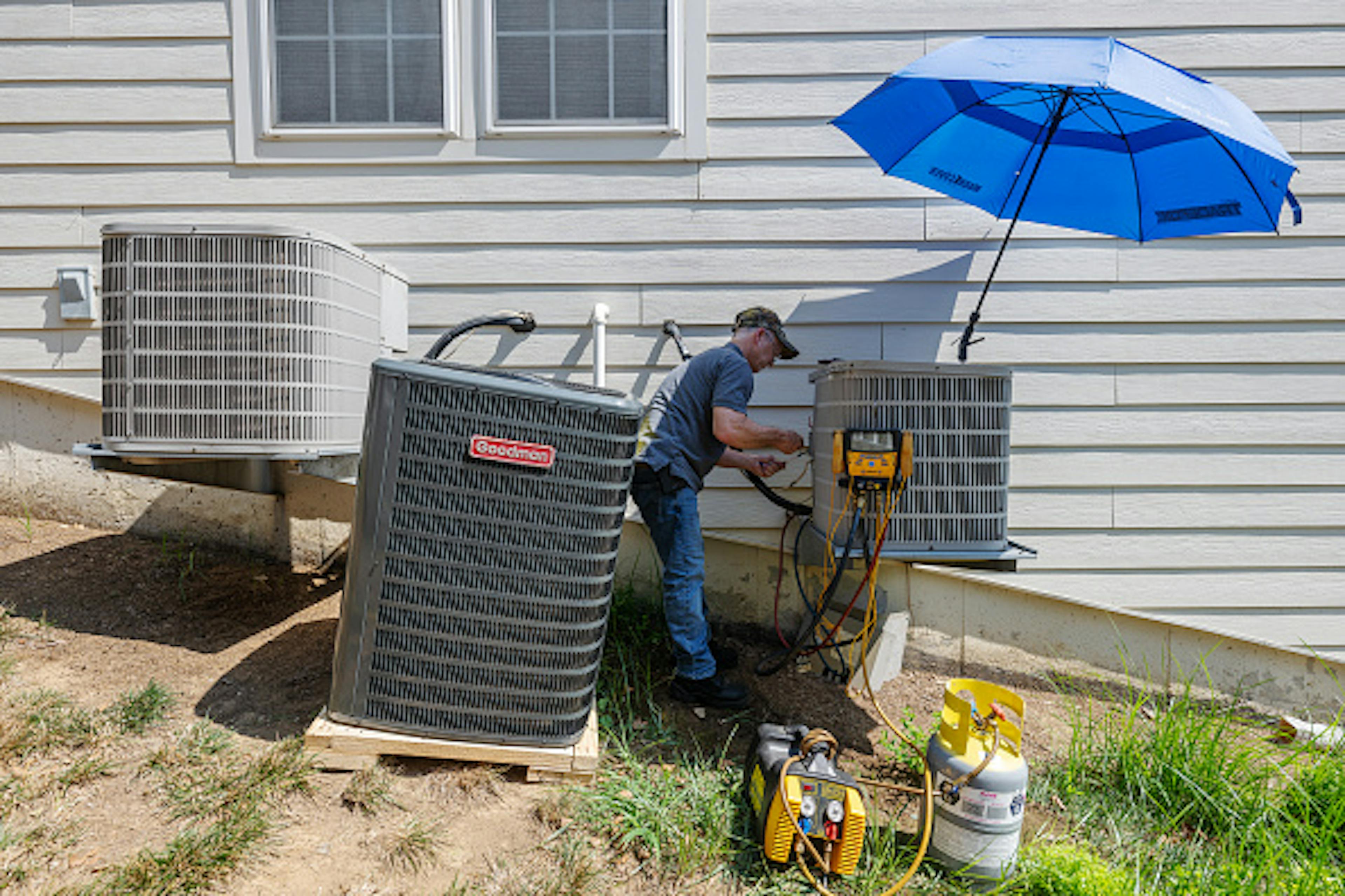 BROADLANDS, VA - JULY 16: HVAC repairman Steve Seneff removes w