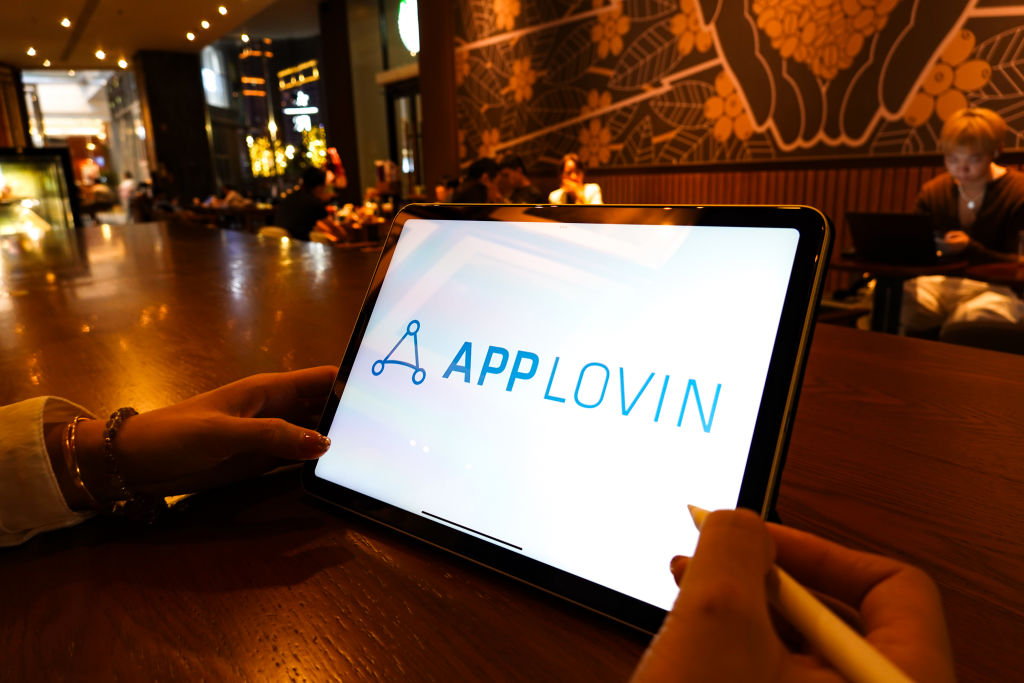 In this photo illustration, an AppLovin logo is displayed on...