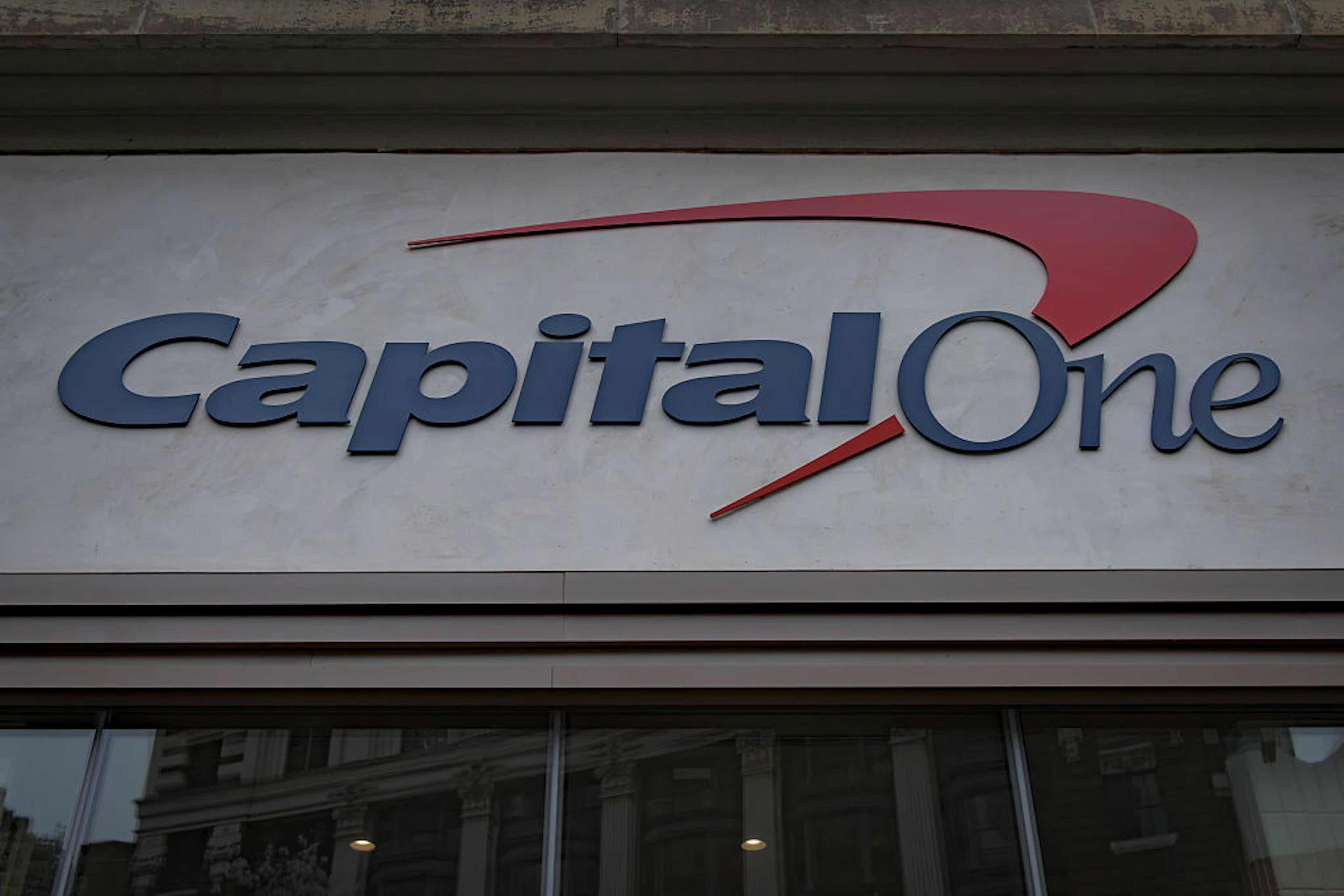 Sign at the entrance to a Capital One bank branch in...