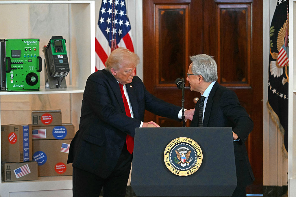 Nvidia CEO Jensen Huang shakes hands with US President Donald Trump