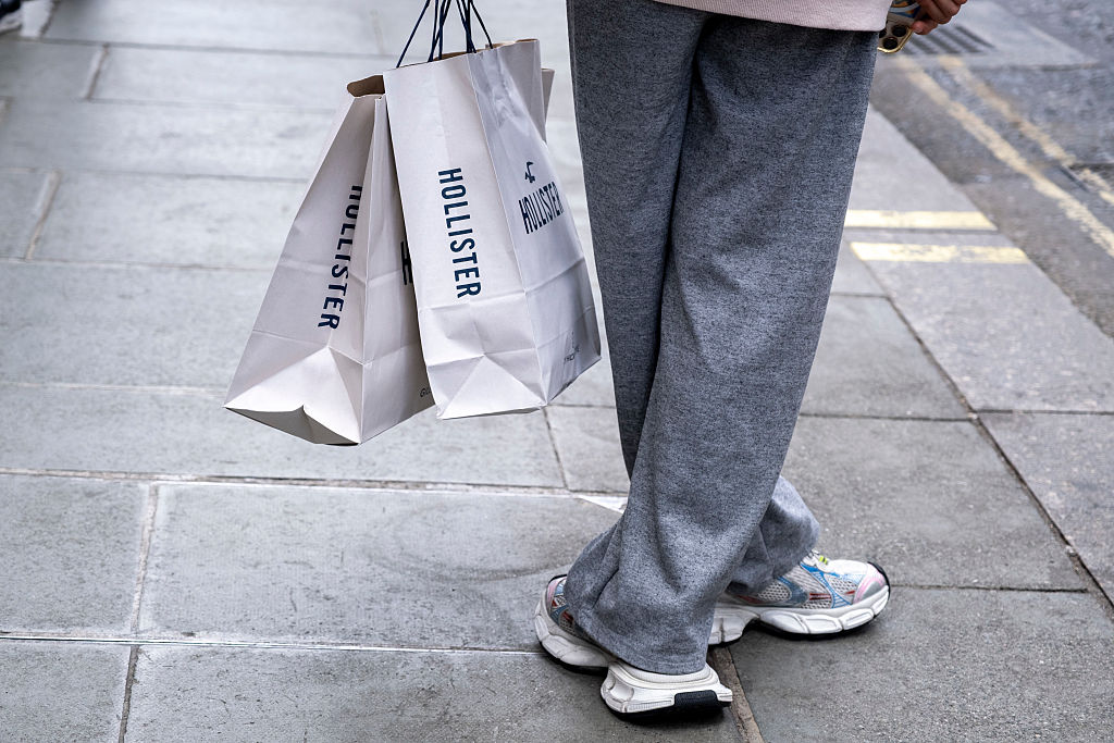 Oxford Street shopper with Hollister bag in London