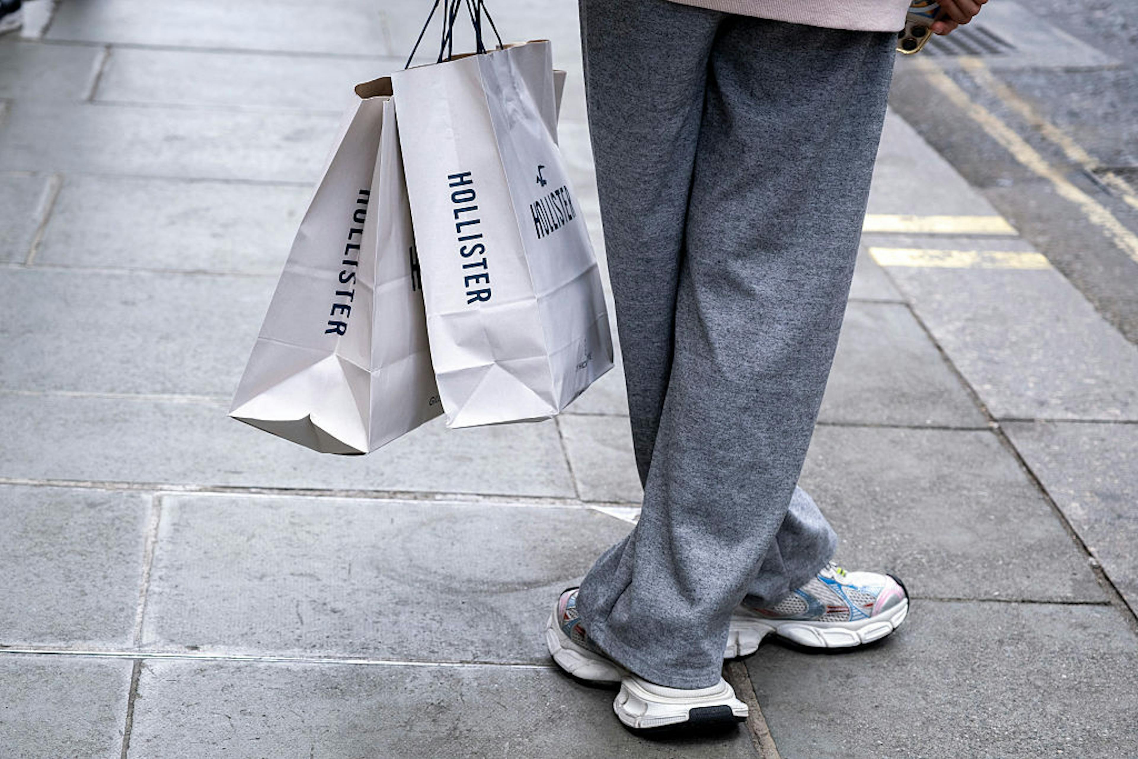 Oxford Street shopper with Hollister bag in London