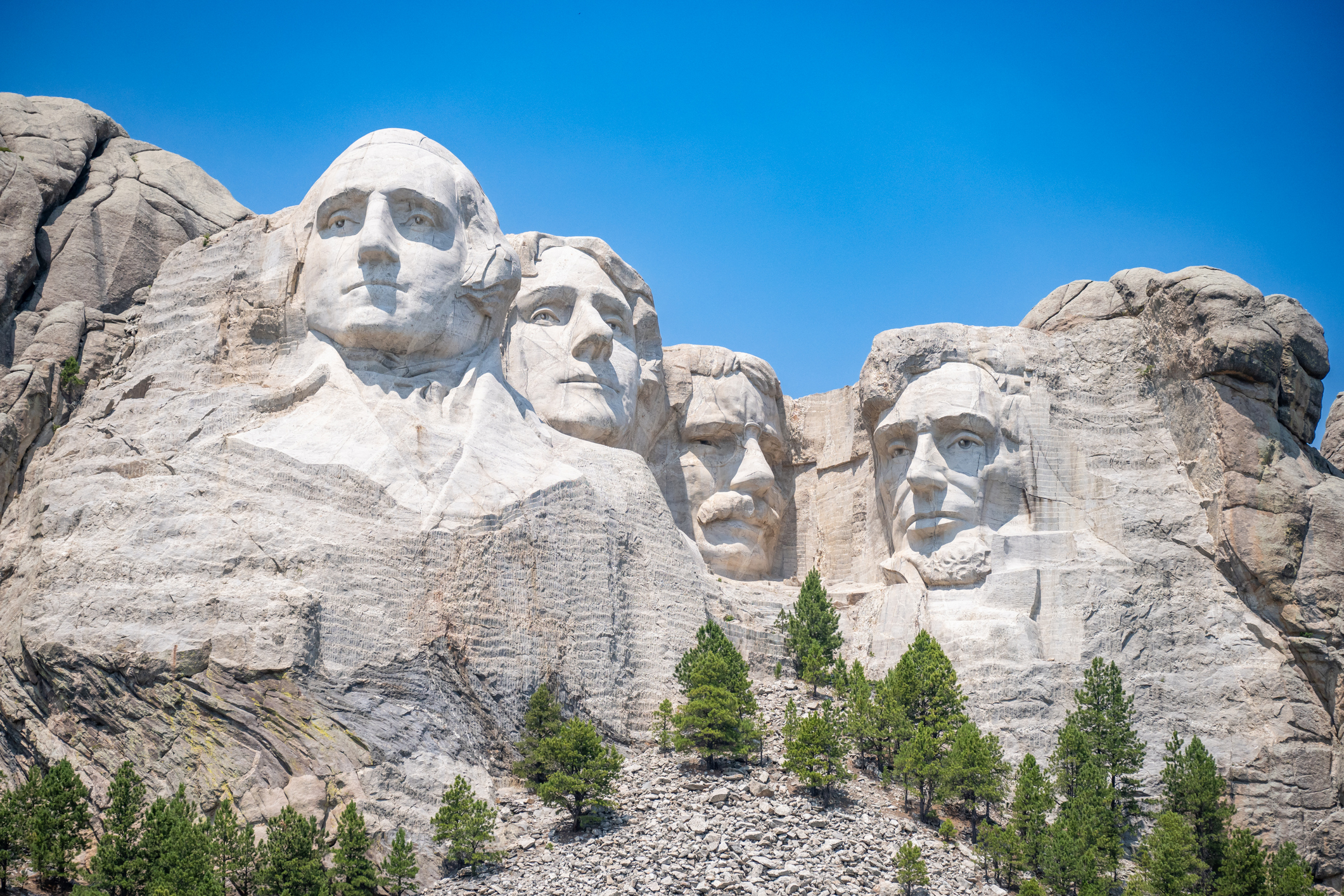 Mount Rushmore in the Black Hills of South Dakota against a clear sky.