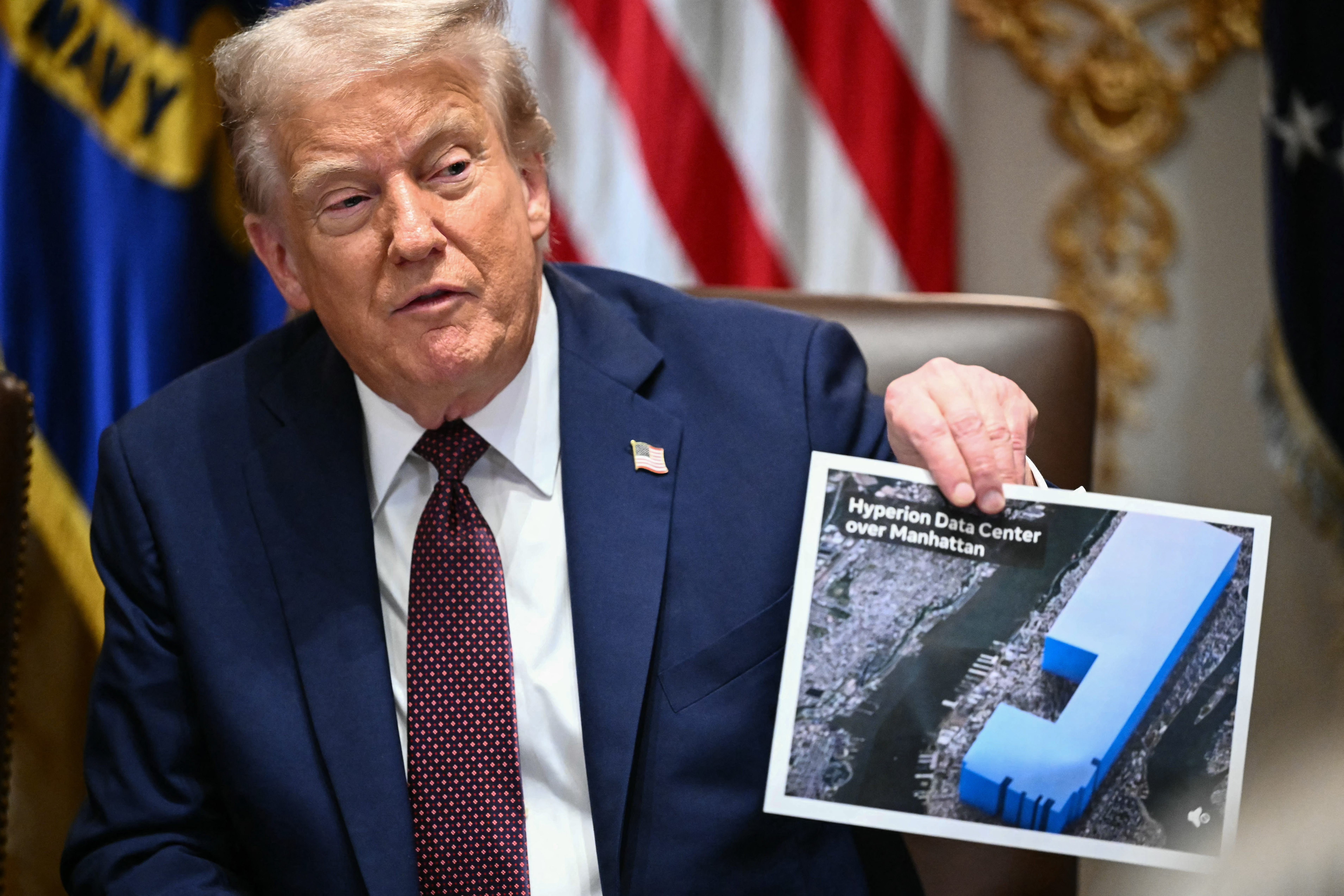 Trump holding a photo of Hyperion